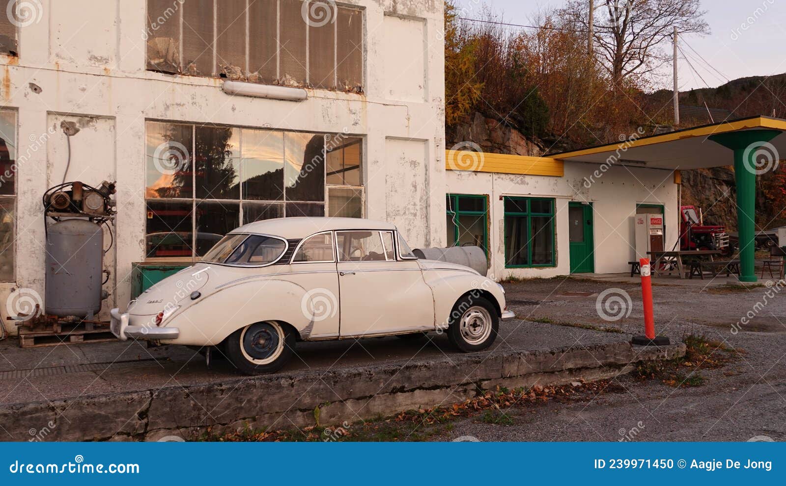 old retro saab in front of vintage bp gasstation in tingvoll in norway