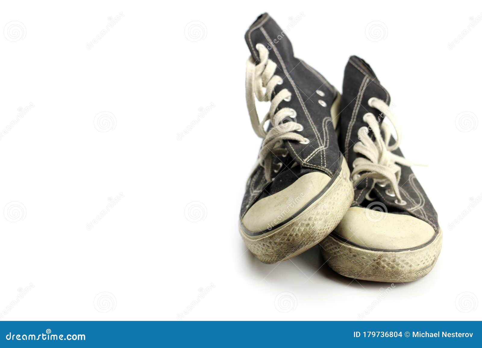 Old Retro Sneakers One on Top of the Other, Isolated on White Stock ...