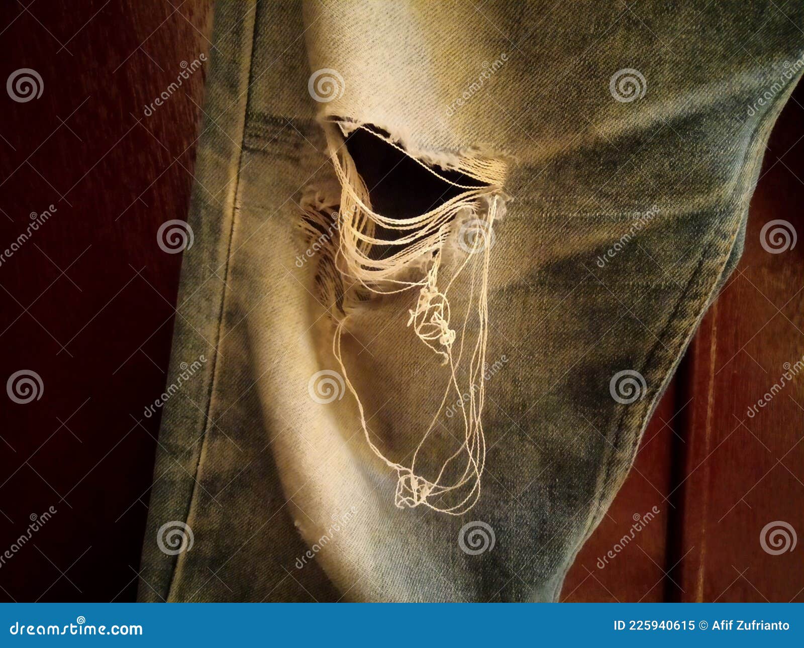 Old Ripped Jeans on the Brown Door Stock Image - Image of depok, jeans ...