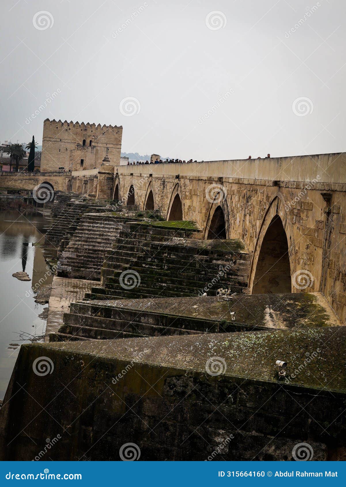 an old roman bridge over guadalquivir river