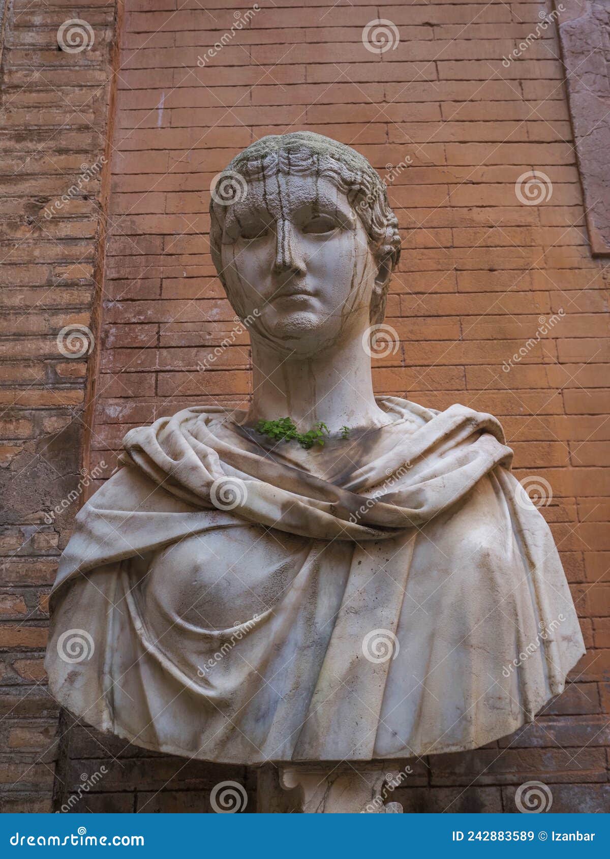 Old Roman Marble Statue with Growing Grass Editorial Stock Image