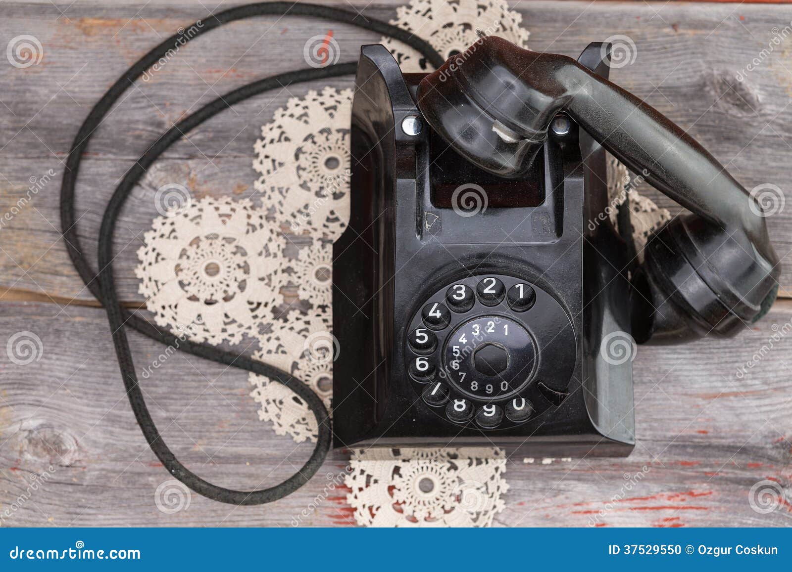 Old Rotary Telephone with the Handset Off the Hook Stock Photo Image