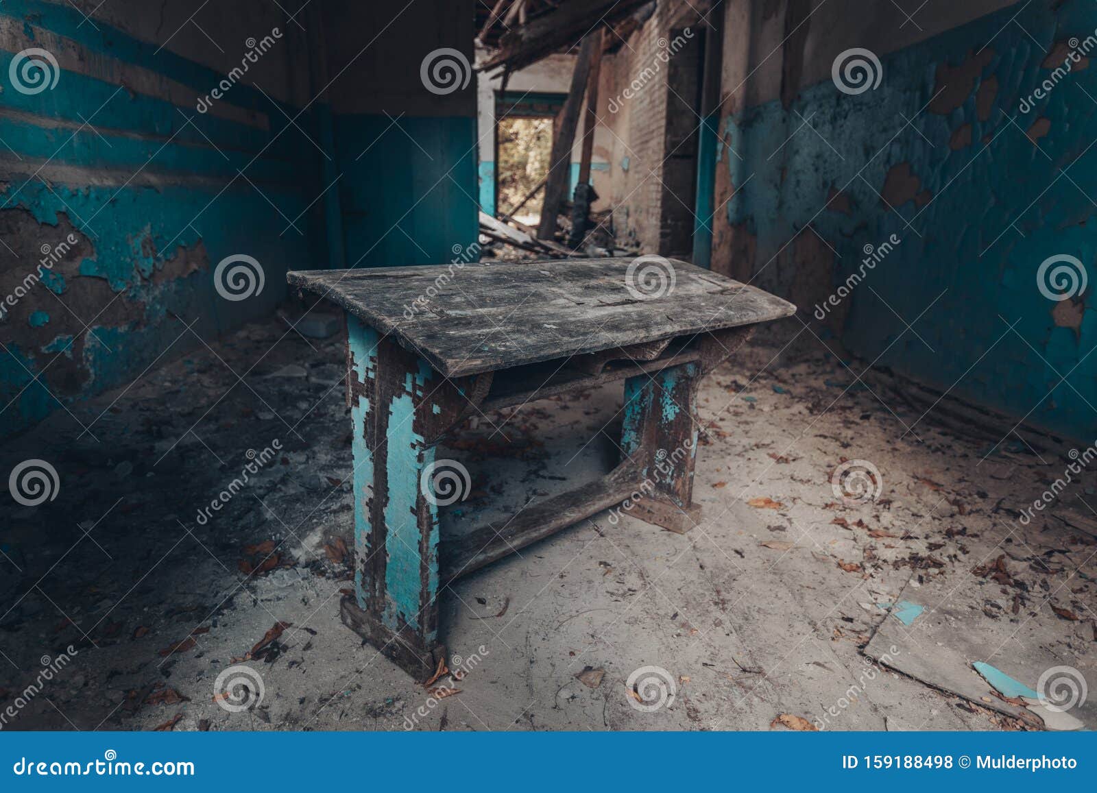 Old Rotten Blue Desk in Abandoned School Corridor Stock Photo Image