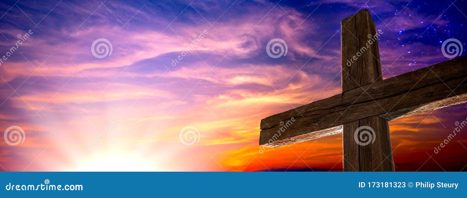 the old rugged cross at sunrise with clouds and starry sky