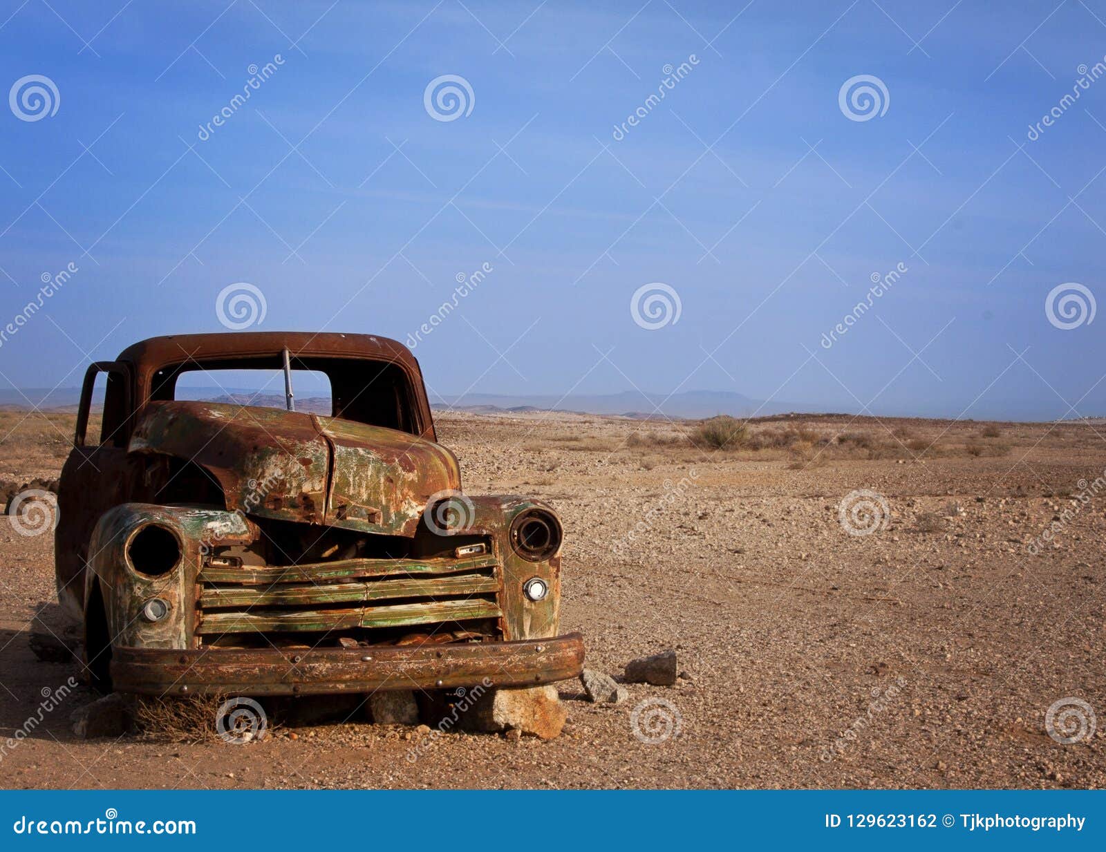 old rusted car desserted in the desert