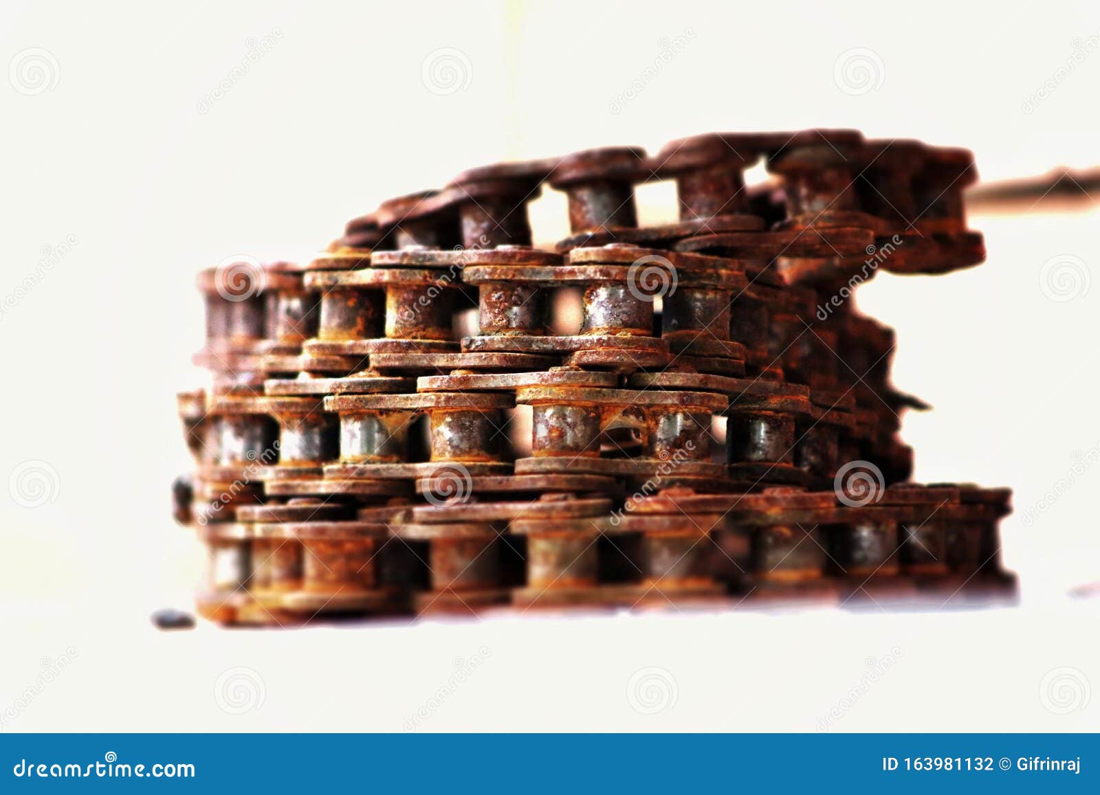 old rusted cycle chain in a white background