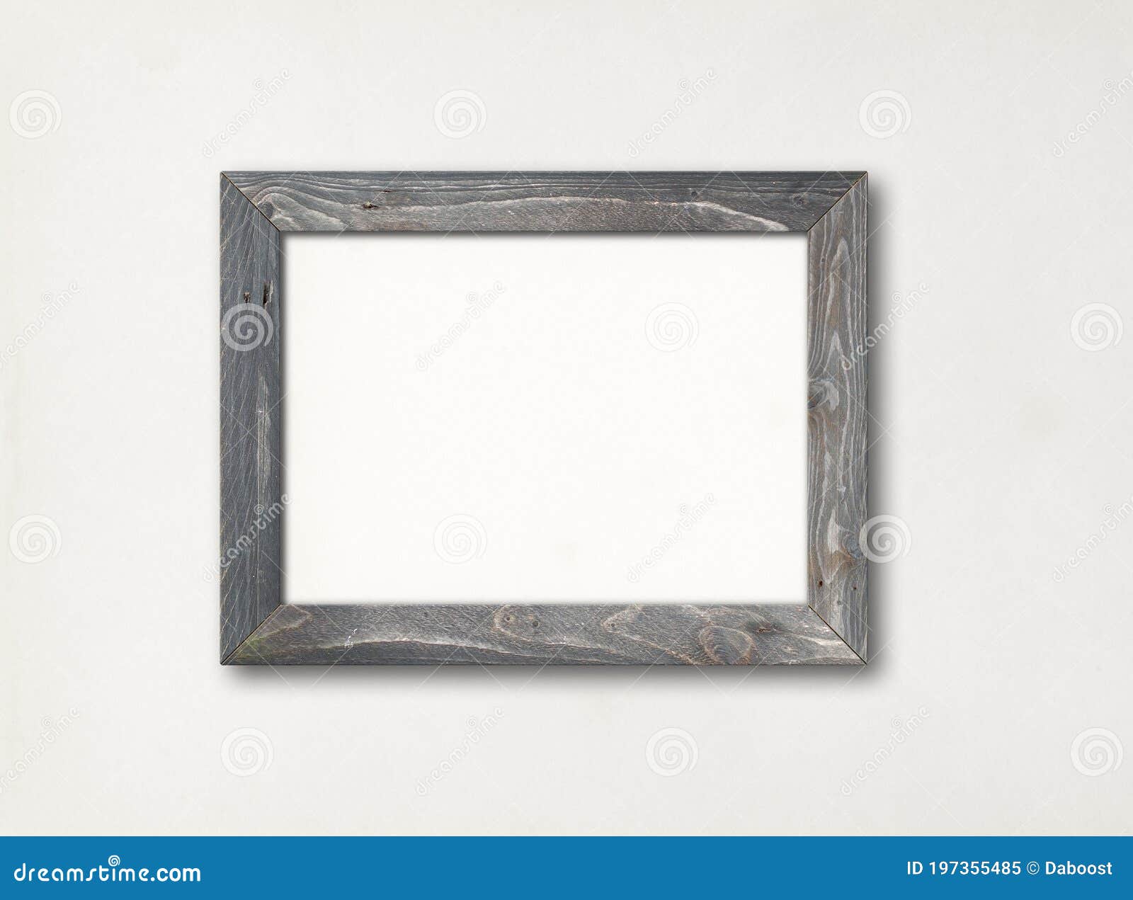 Old Rustic Wooden Picture Frame Hanging on a White Wall Stock Image