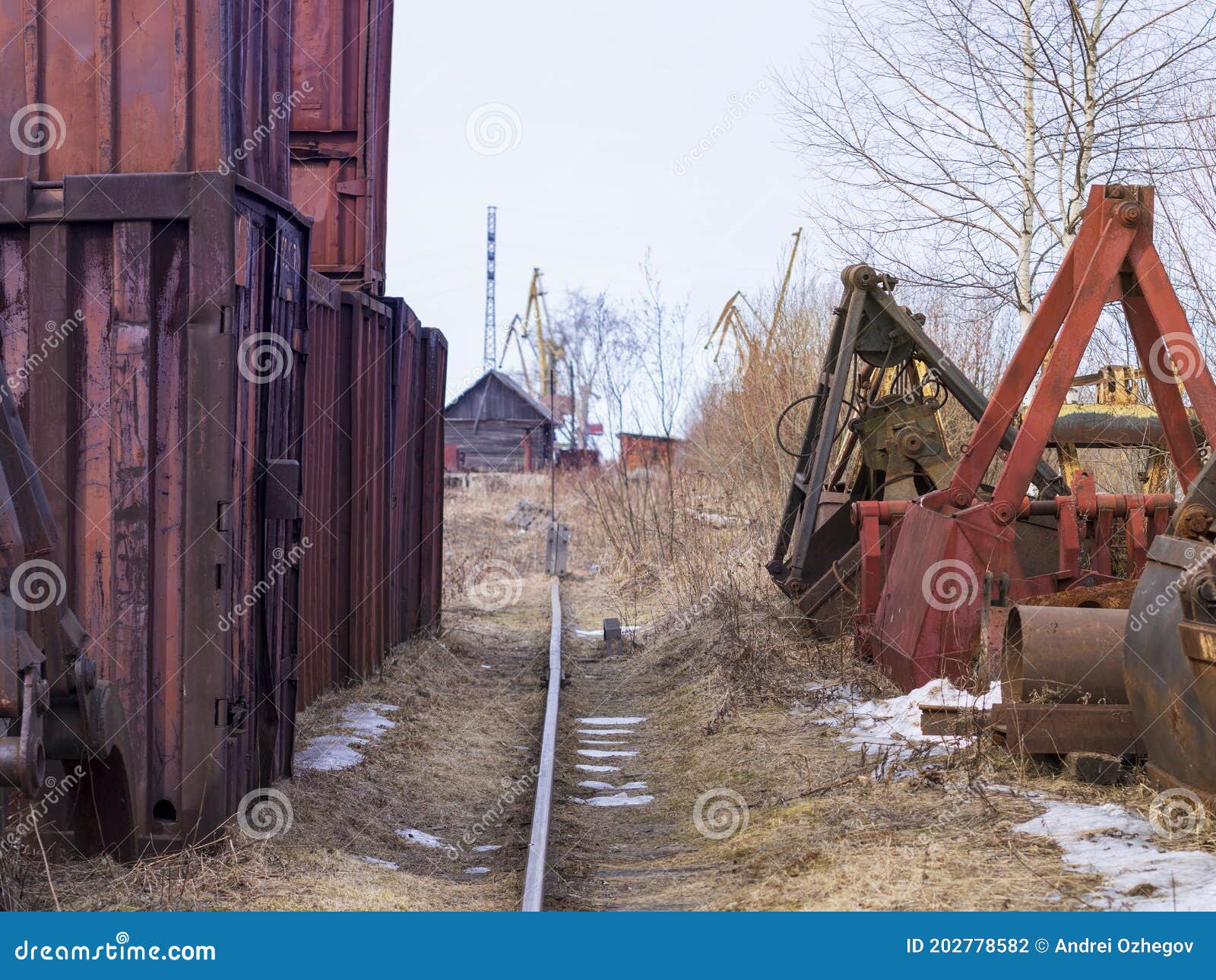 old rusty abandoned building gantry crane on rusty rails. abandoned container loading construction warehouse. dead zona