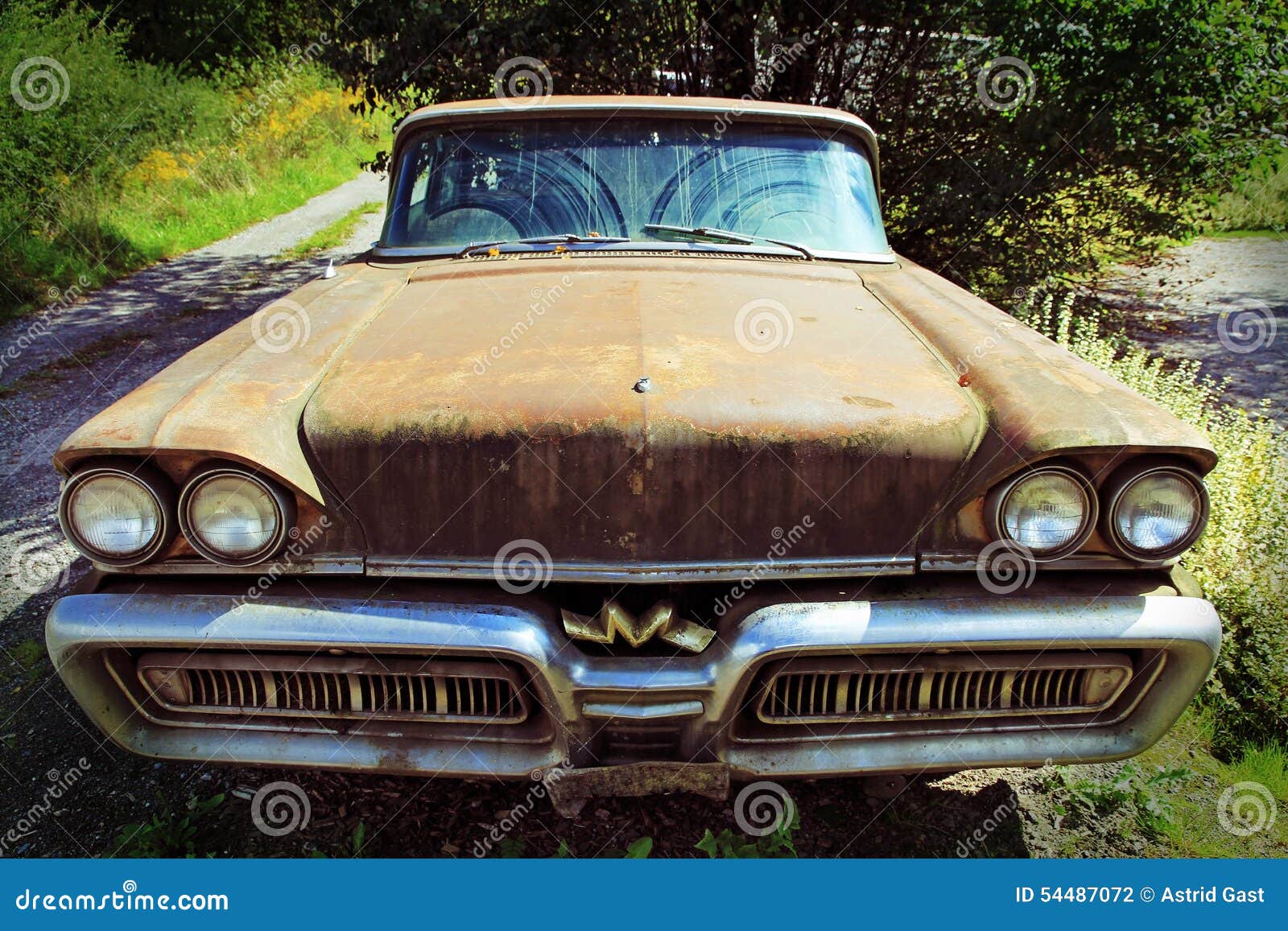 The old rusty car. An old Mercury from the USA