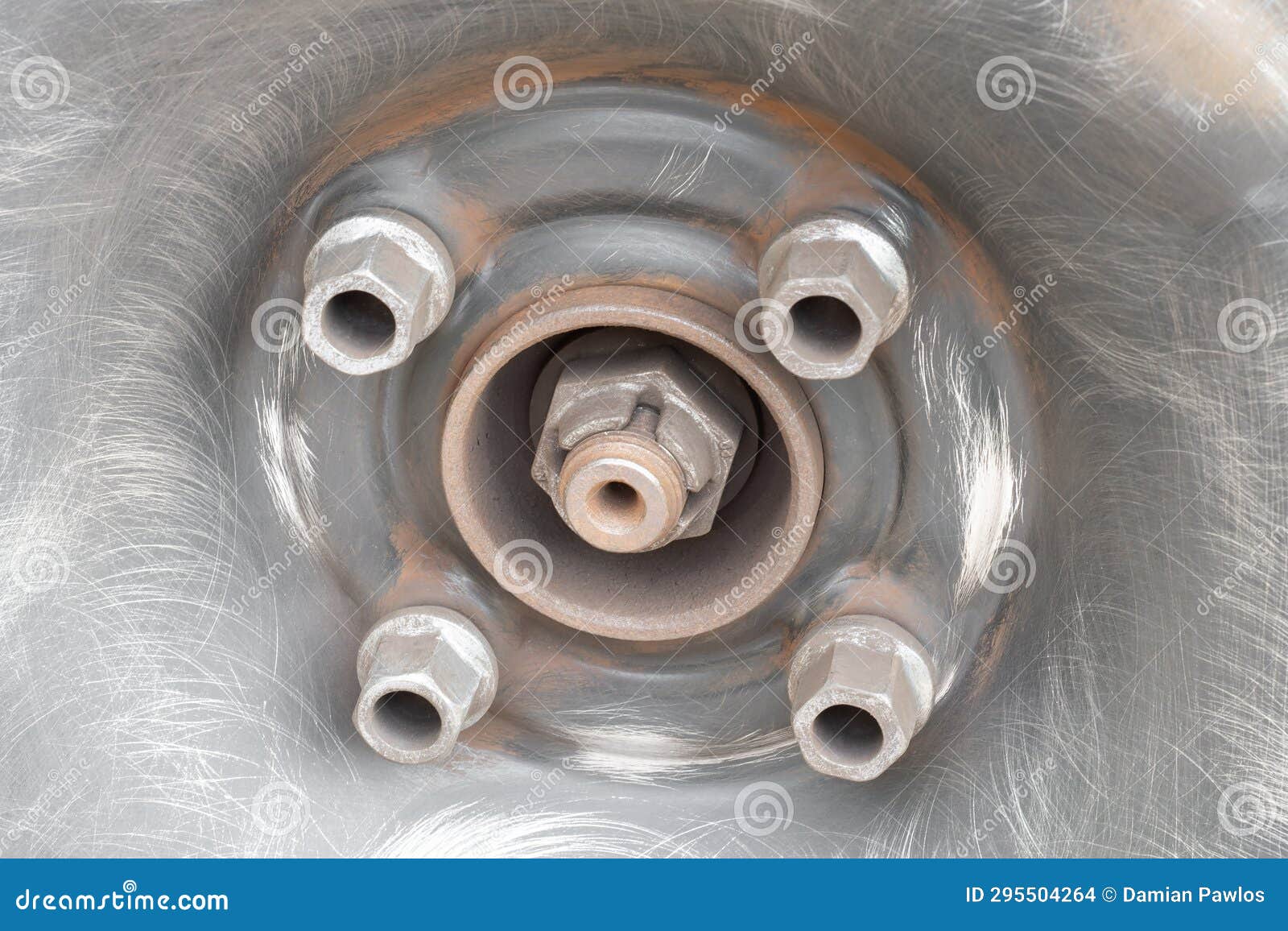 Old Rusty Car Wheels Refinishing Process. Lug Bolts after Removing the