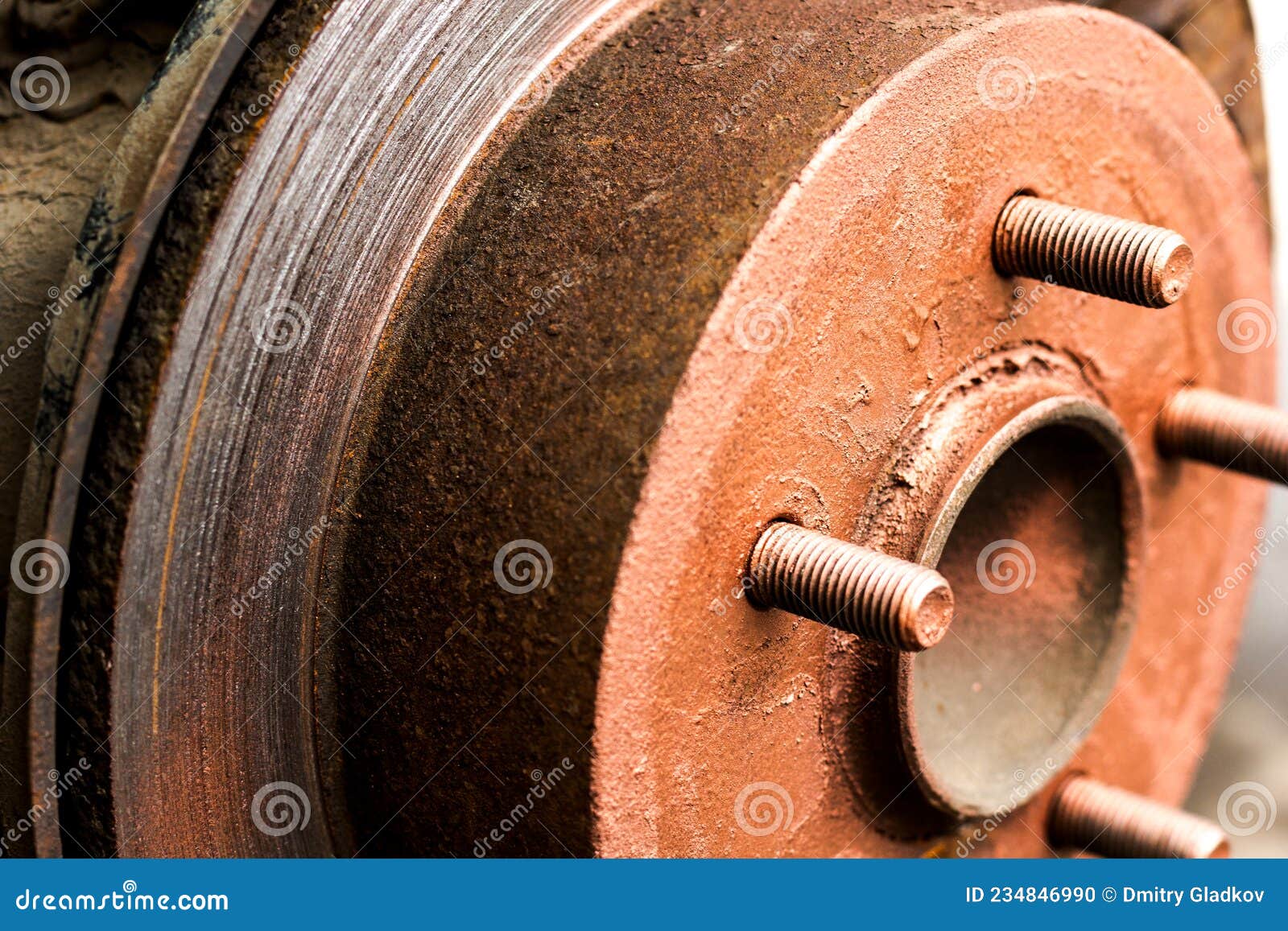 An Old Rusty Hub without a Wheel. Brake Disc and Brake Caliper on the