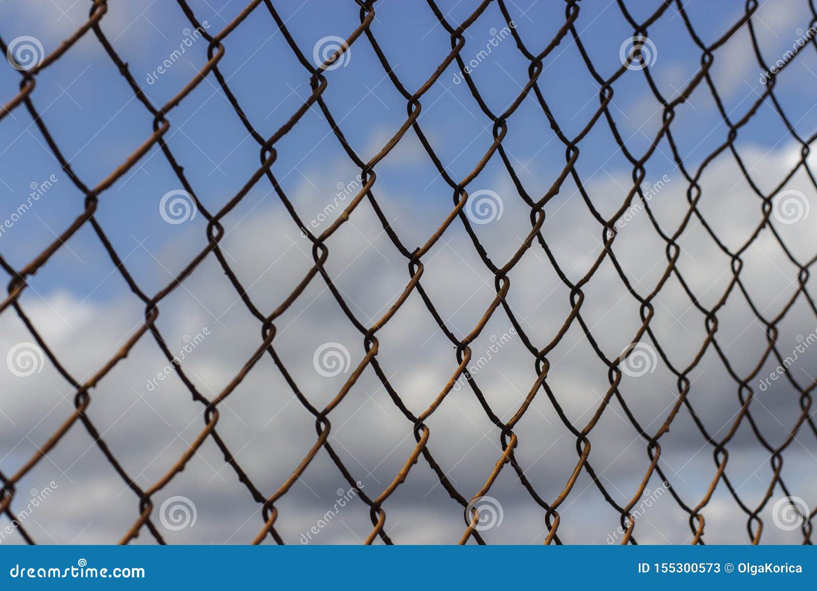 Old Rusty Mesh Netting Diagonally Against A Blue Sky With Clouds ...
