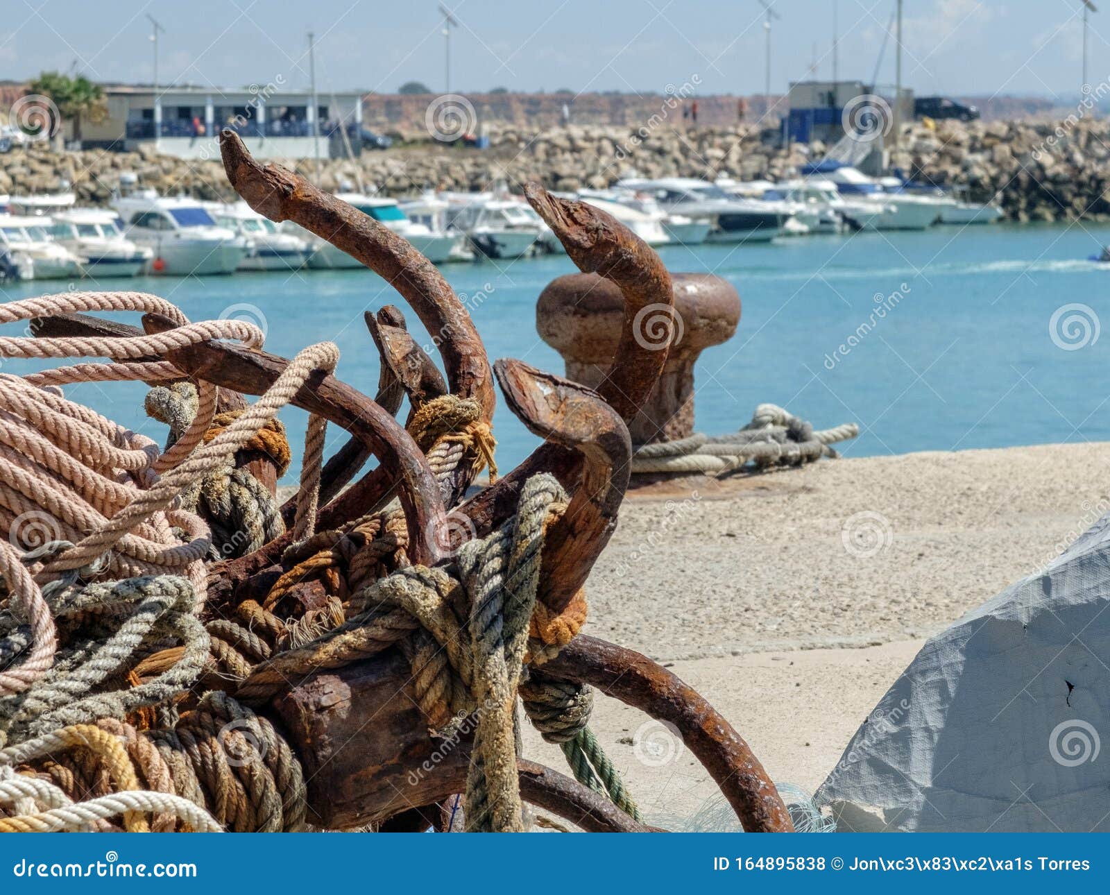 Old Rusty Ship Anchors Abandoned on the Ground in Port Stock Photo - Image  of sailing, marina: 164895838