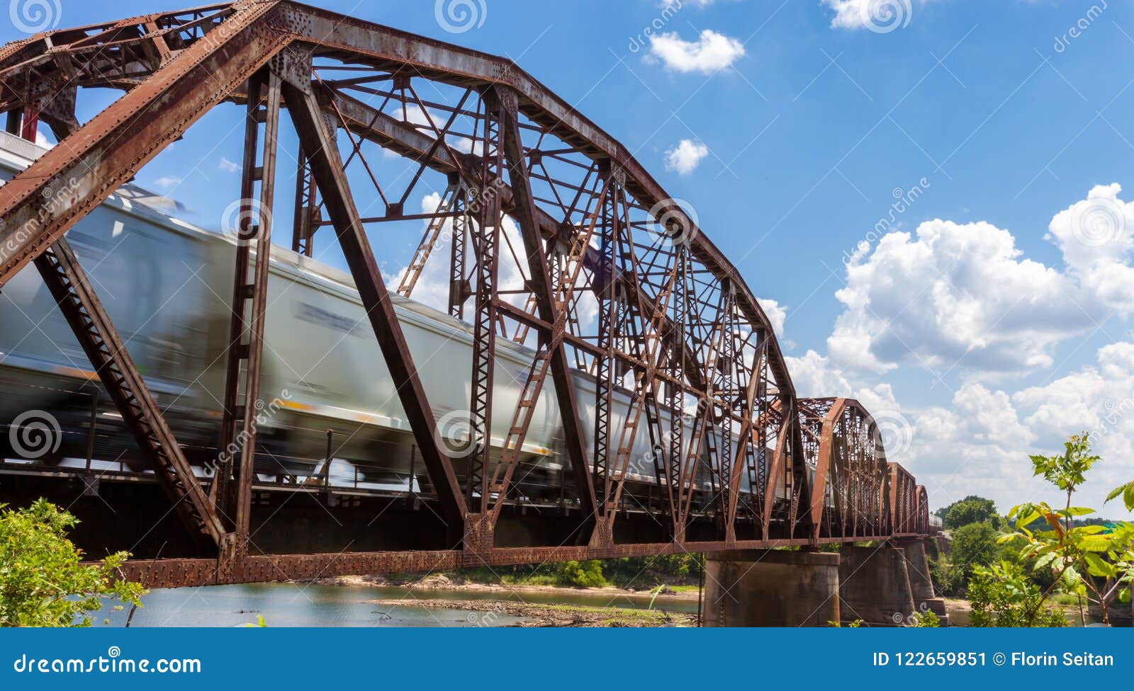 Old Rusty Truss Bridge With Moving Freight Train Over The Red Ri Stock Image Image Of Heavy Railway