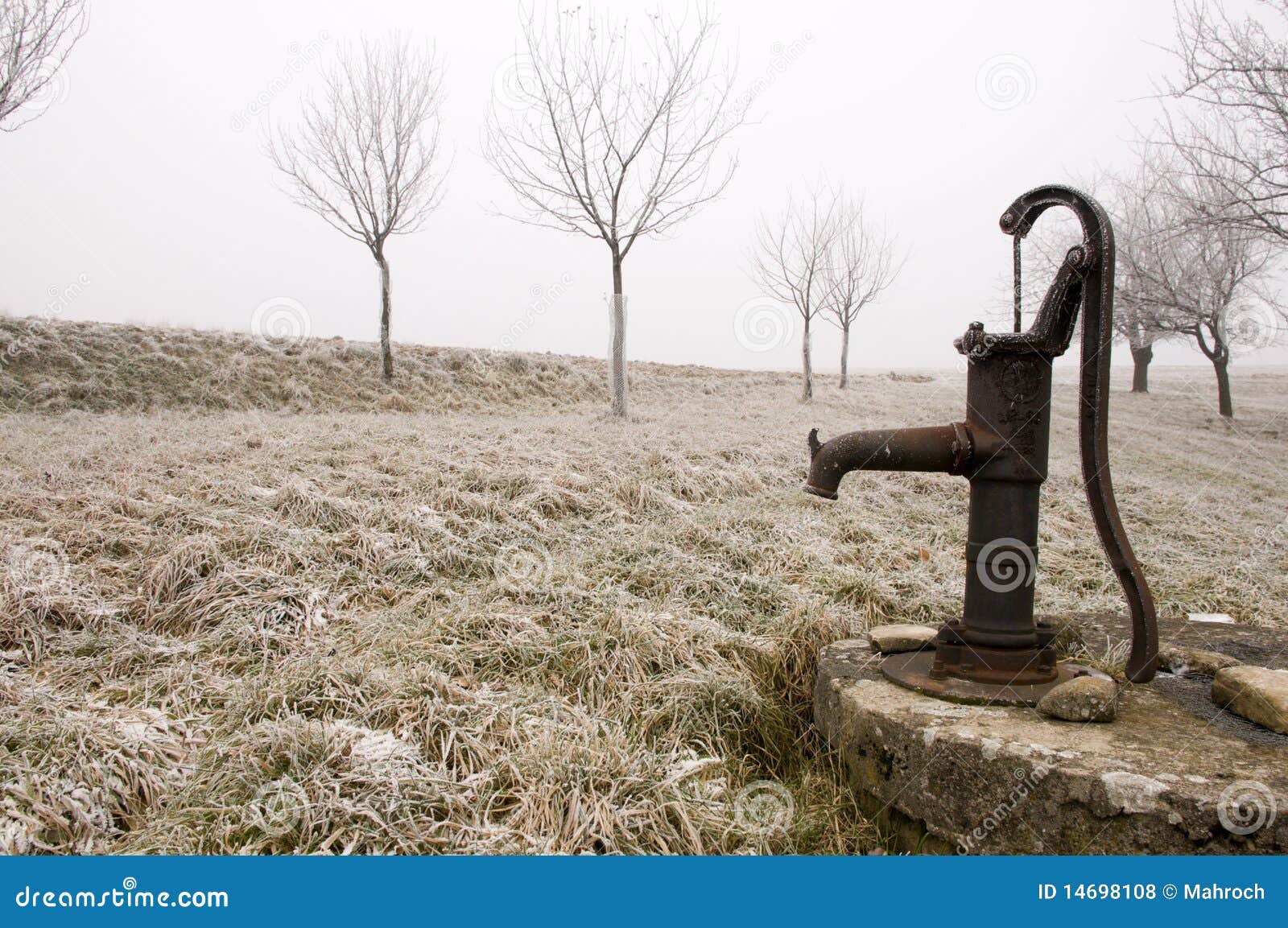 Old Rusty Water Pump on the Countryside in Winter Stock Photo Image