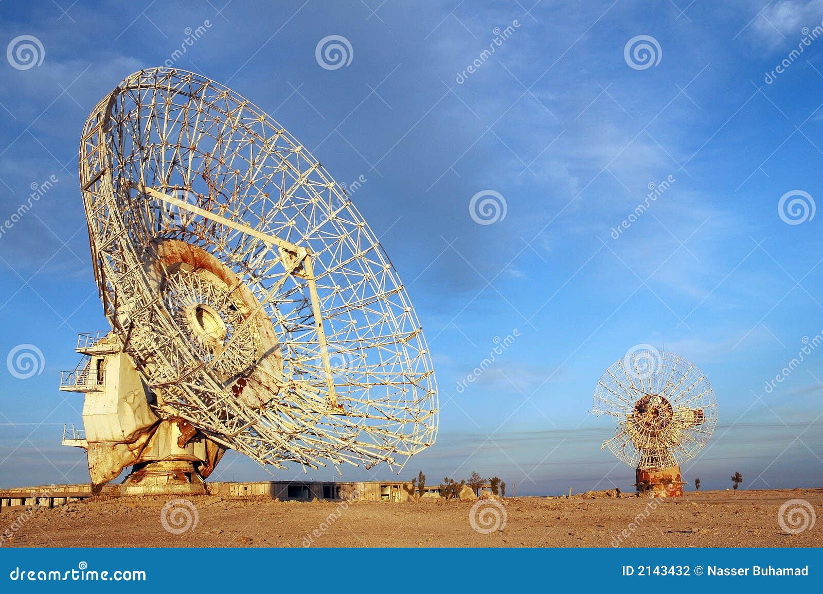 old satalite dish in blue sky