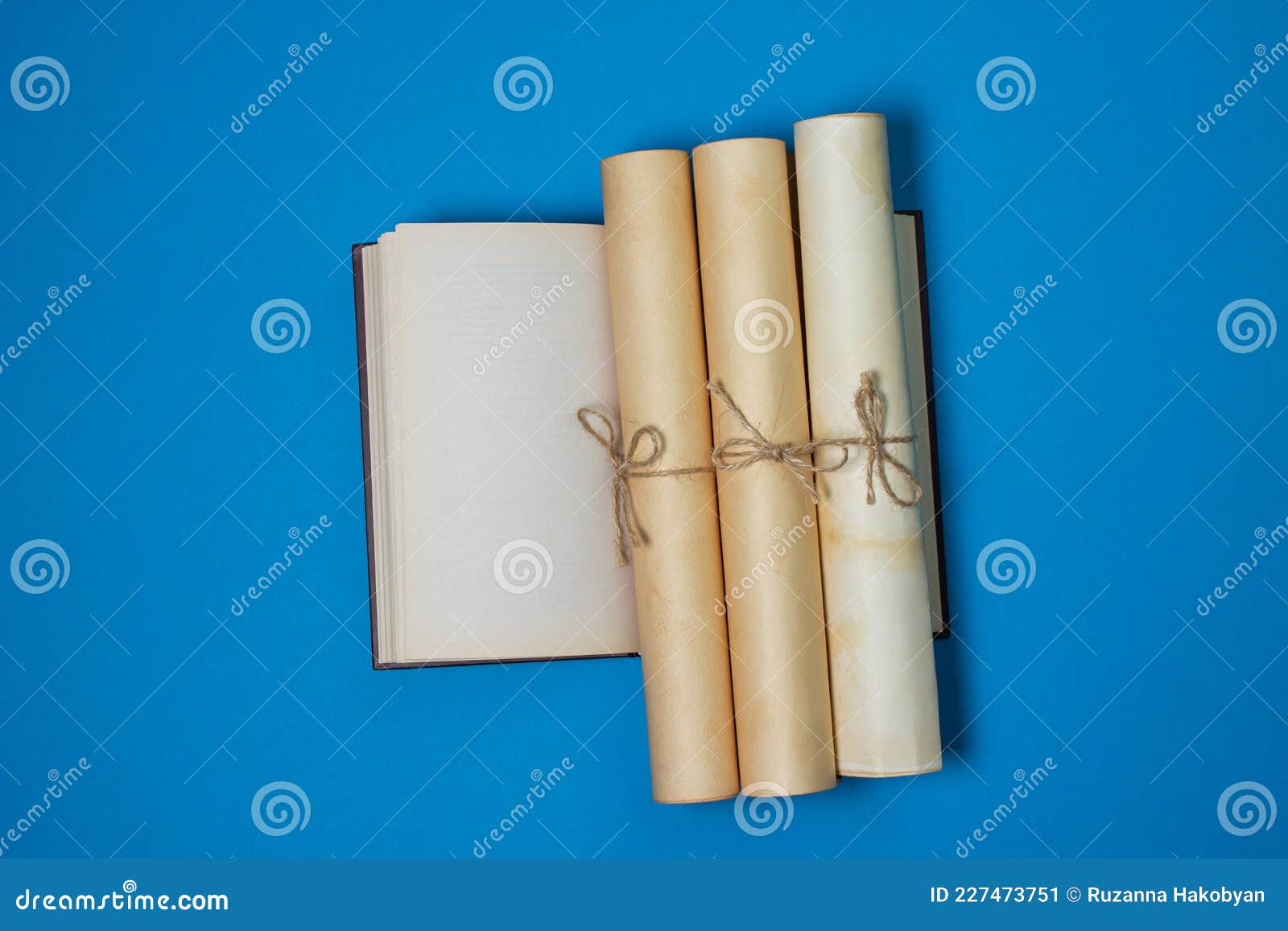 Ancient scrolls stacked on pile. Old scroll library. Stock Photo