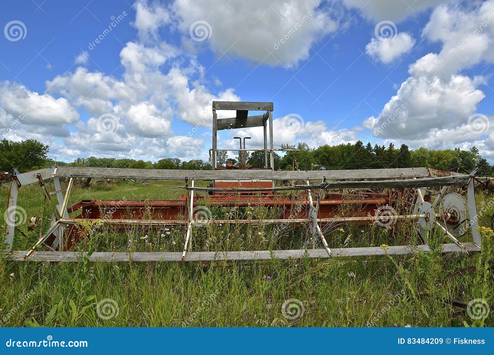 old self-propelled swather