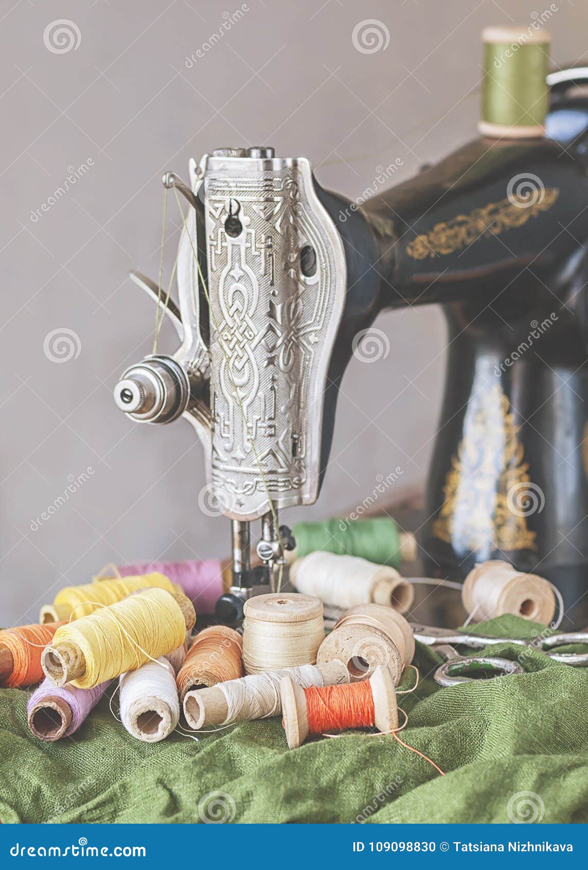 Old Sewing Machine and Vintage Spools of Thread/. Stock Photo Image