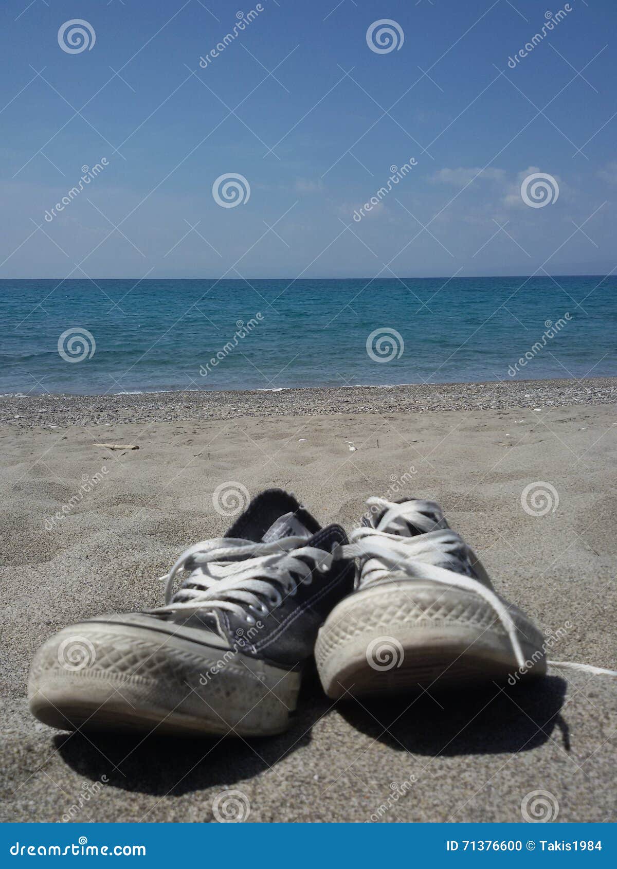 Old Shoes at the beach stock photo. Image of tranquil 71376600