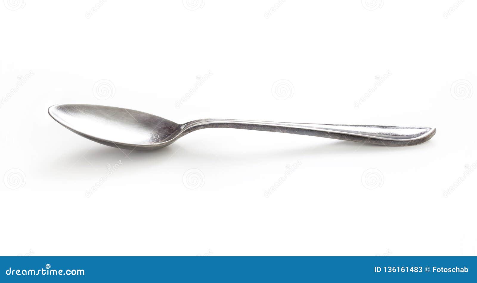 old silver spoon  on white with clipping path included