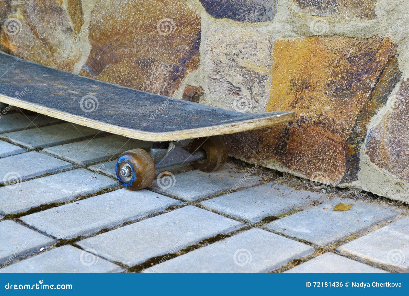 Old Skateboard from a Stone Wall Stock Photo Image of positive