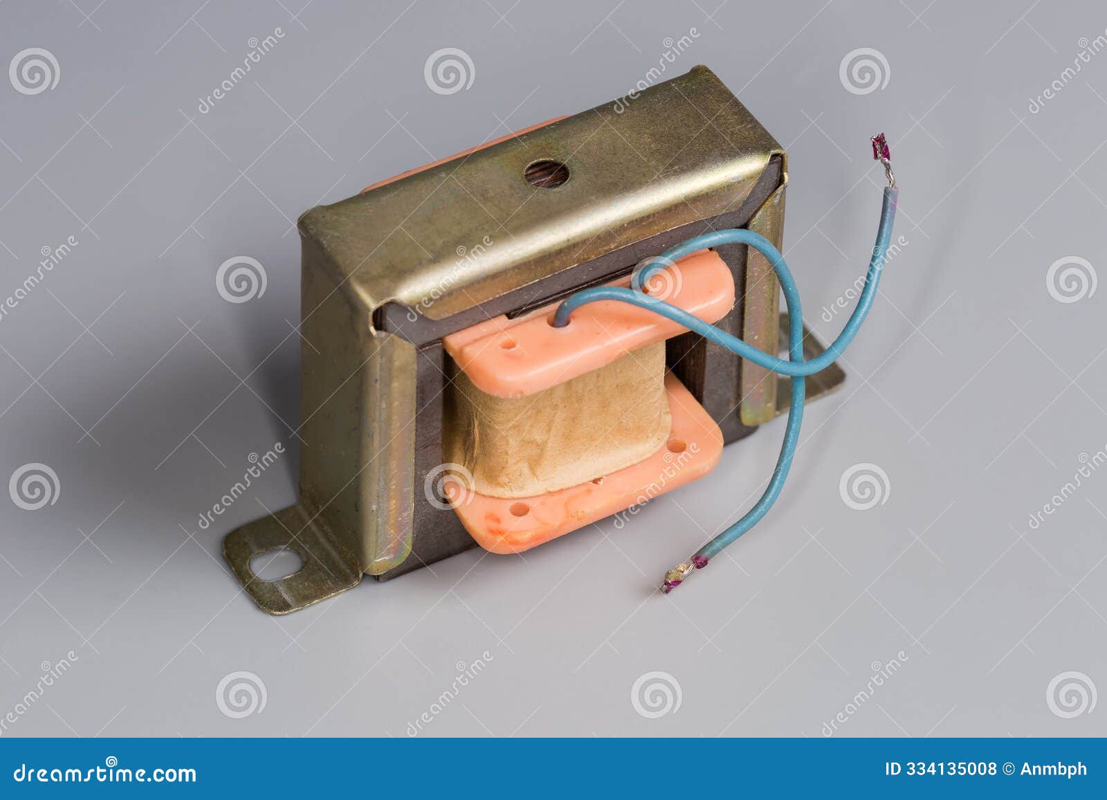 old small-sized mains transformer on a gray surface