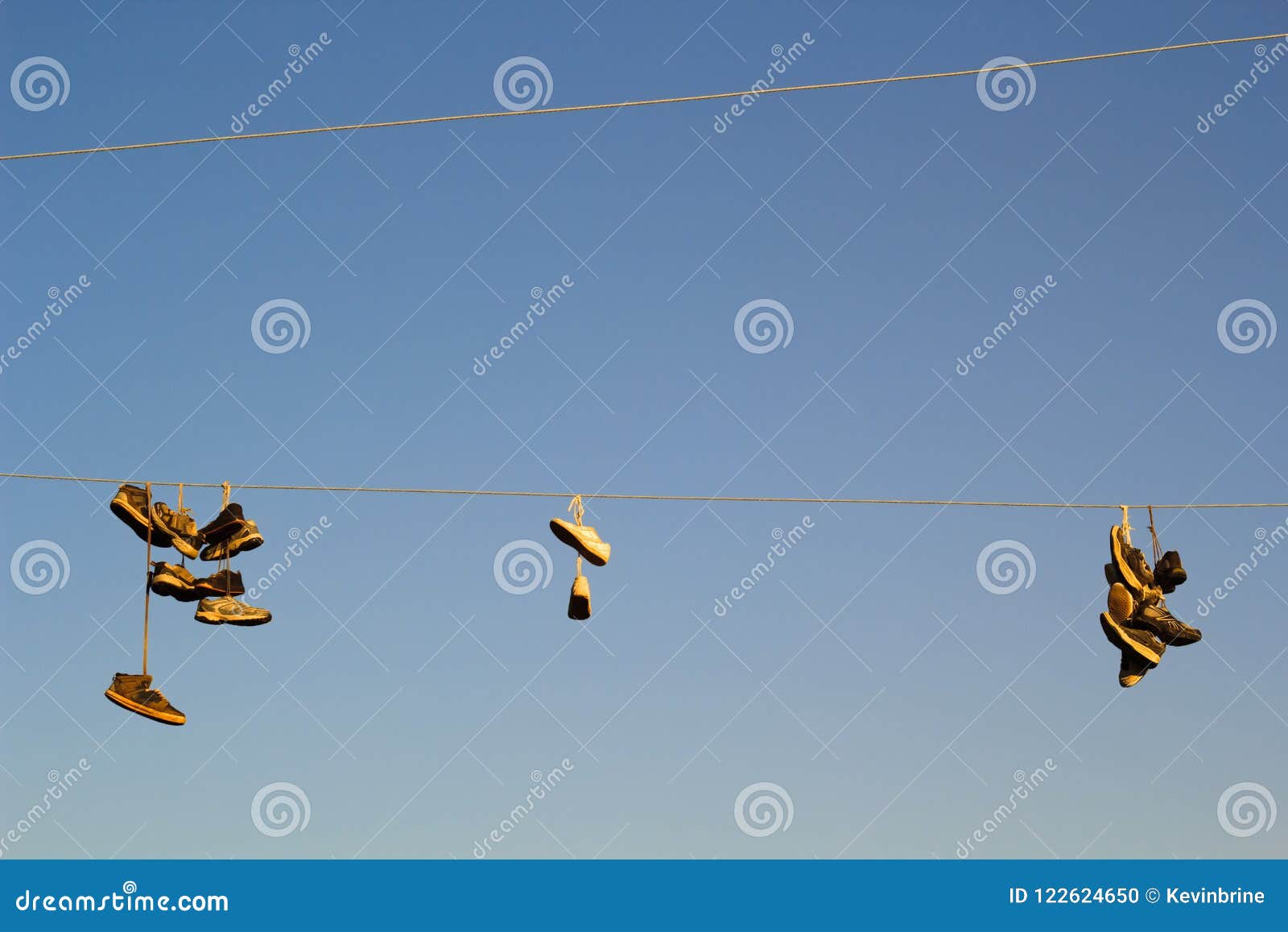 Sneakers on Utility Line stock photo. Image of electrical - 122624650