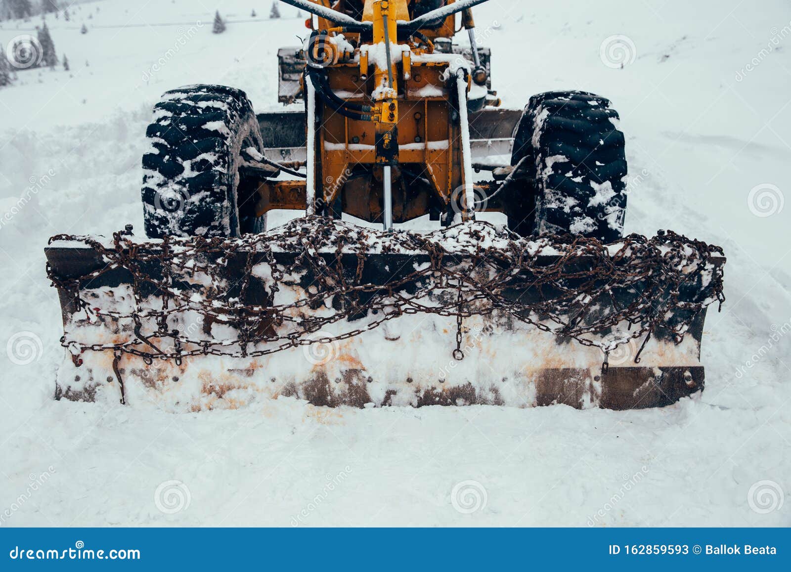 Old Snow Plow Cleaning Roads Covered in Snow Up in the Mountains Stock