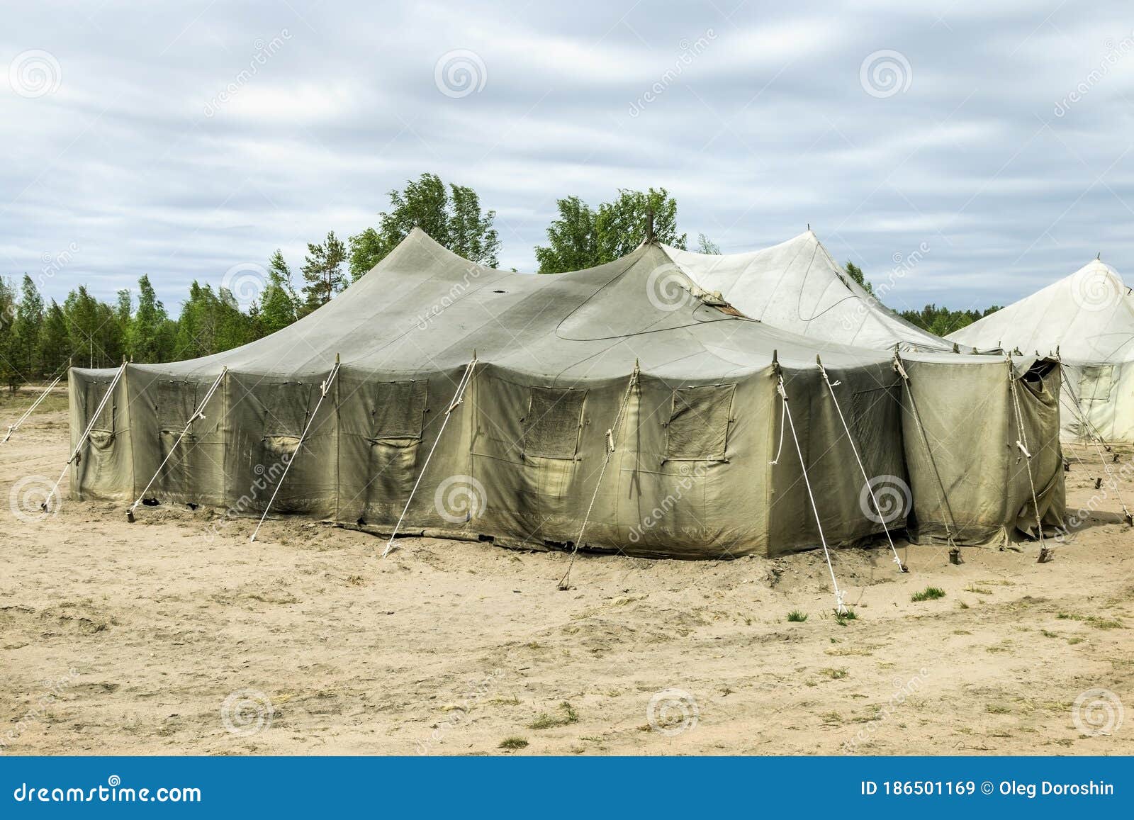 Old Soldiers ` Tents Torn in the Wind in the Field Stock Image