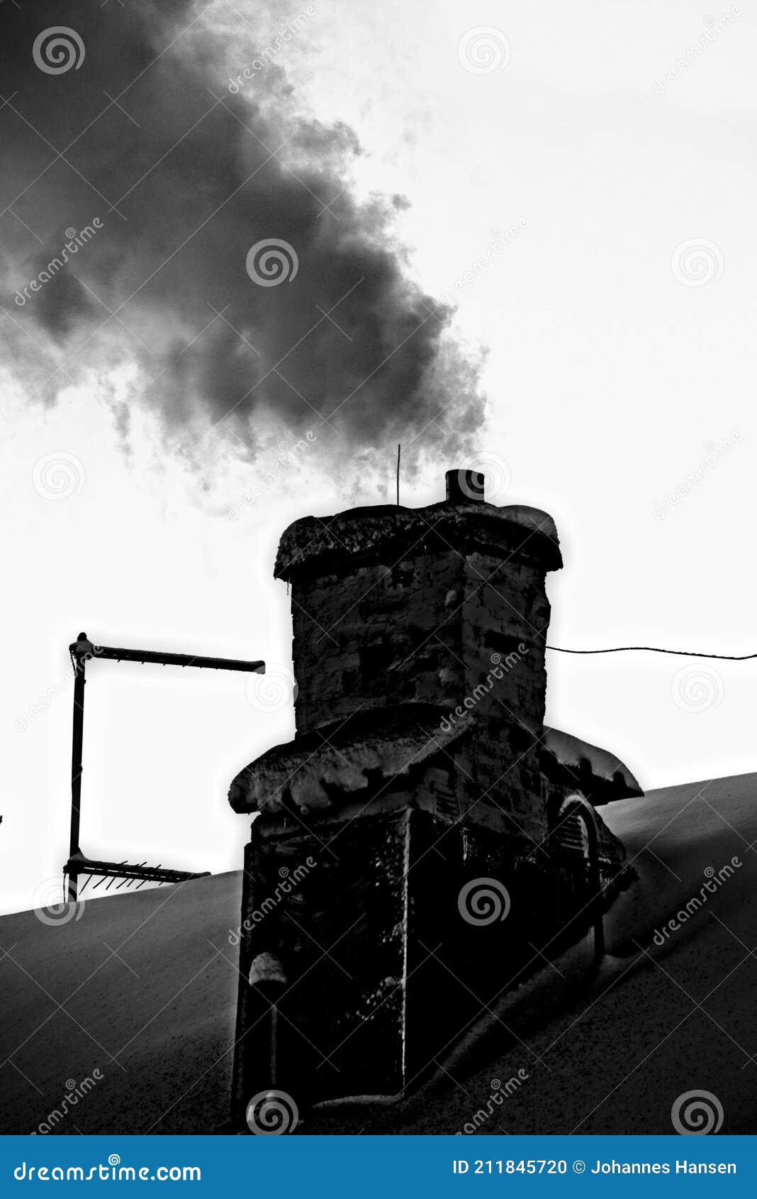 old and sooty chimney with lots of smoke