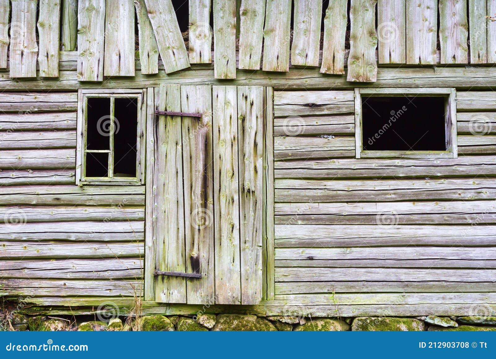 old spooky weather beaten timbered barn