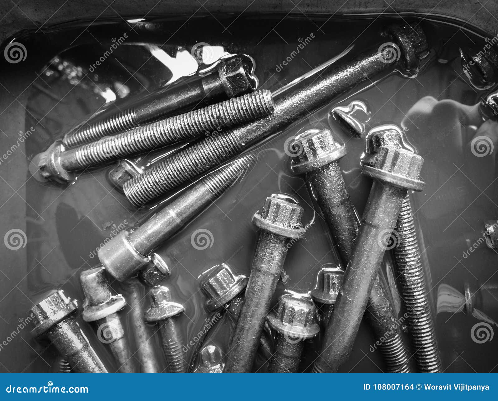 Nut and bolt Engine oil stock photo. Image of engineering 108007164