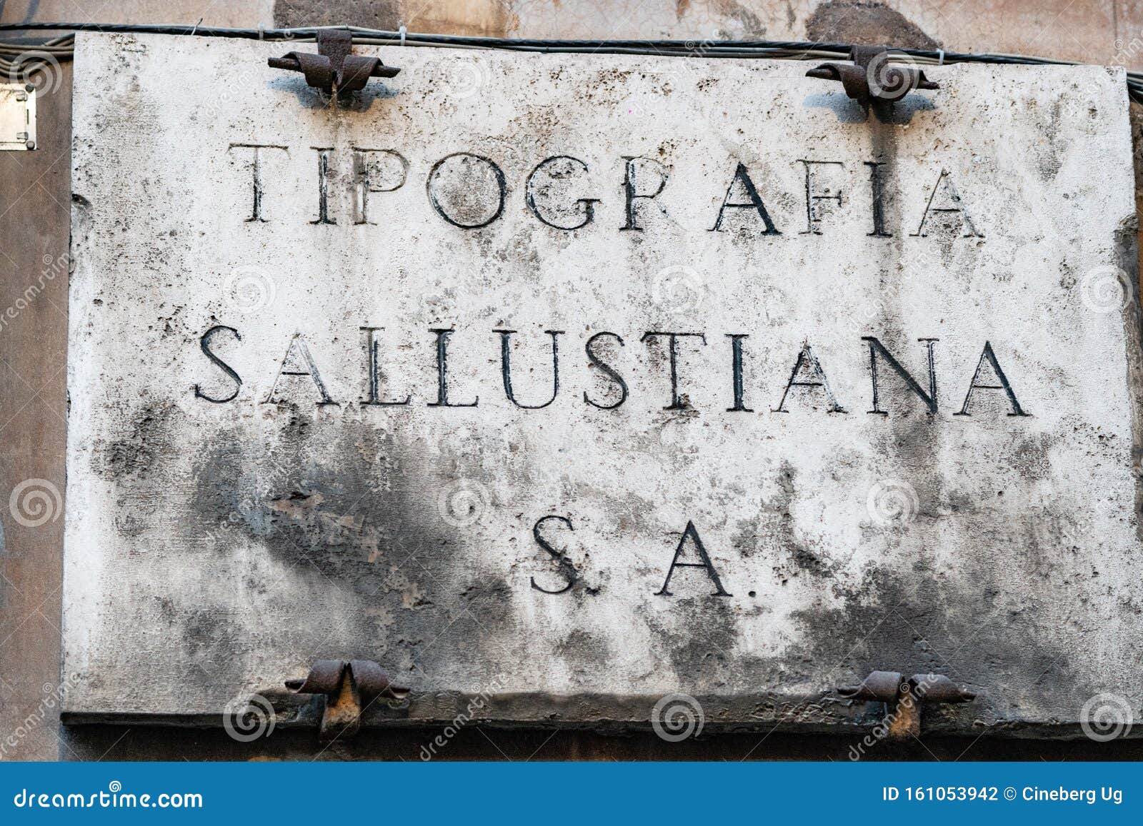 old stone sign of tipografia sallustiana, rome, italy