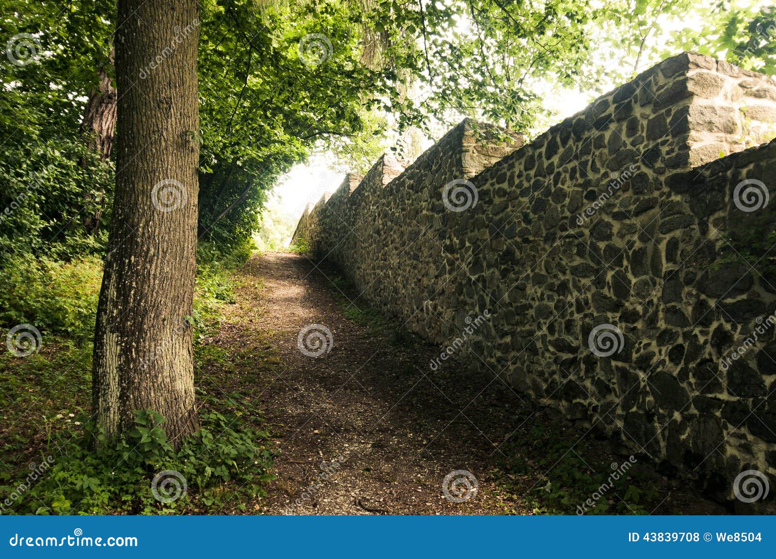 old stone wall bordering the park
