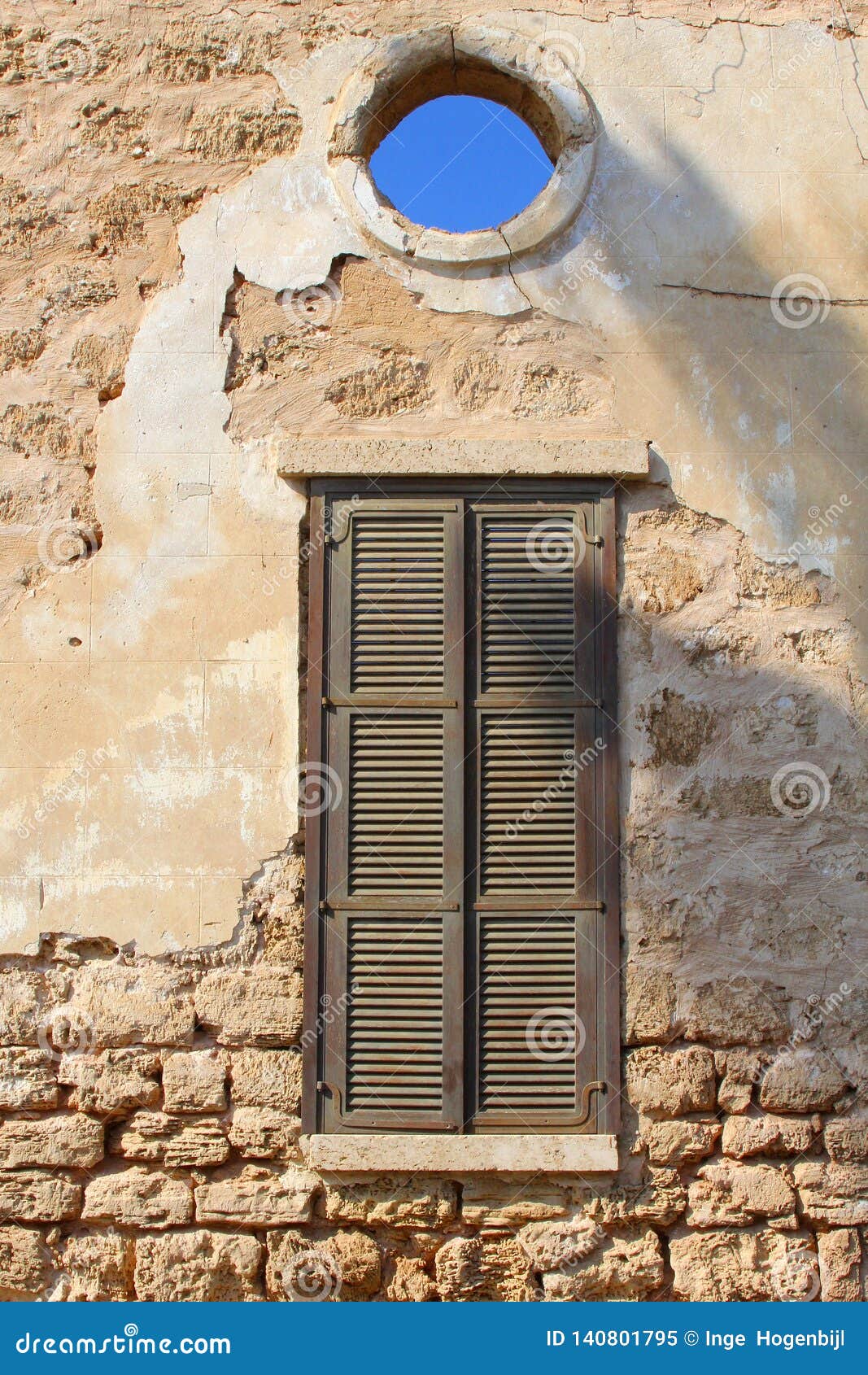 old wall shutters opening view blue sky, neve tzedek, tel aviv