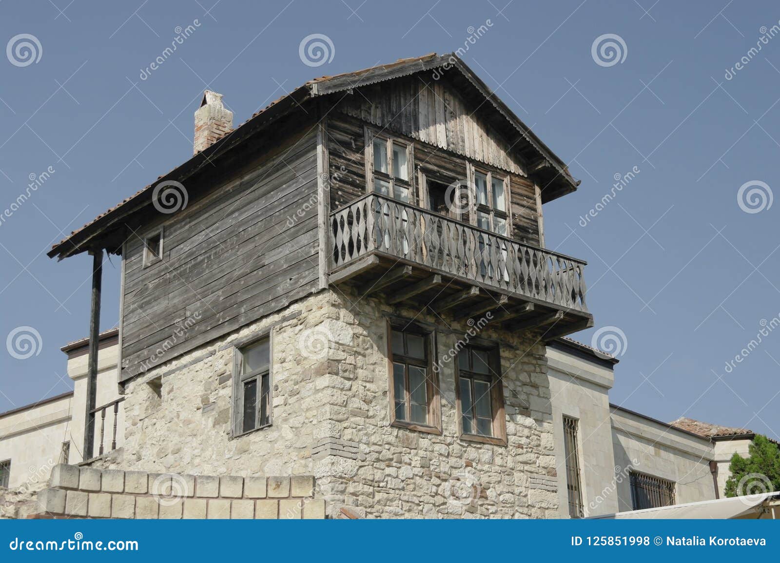 Old Stone And Wood House With Tiled Roof In Bulgaria Stock Photo