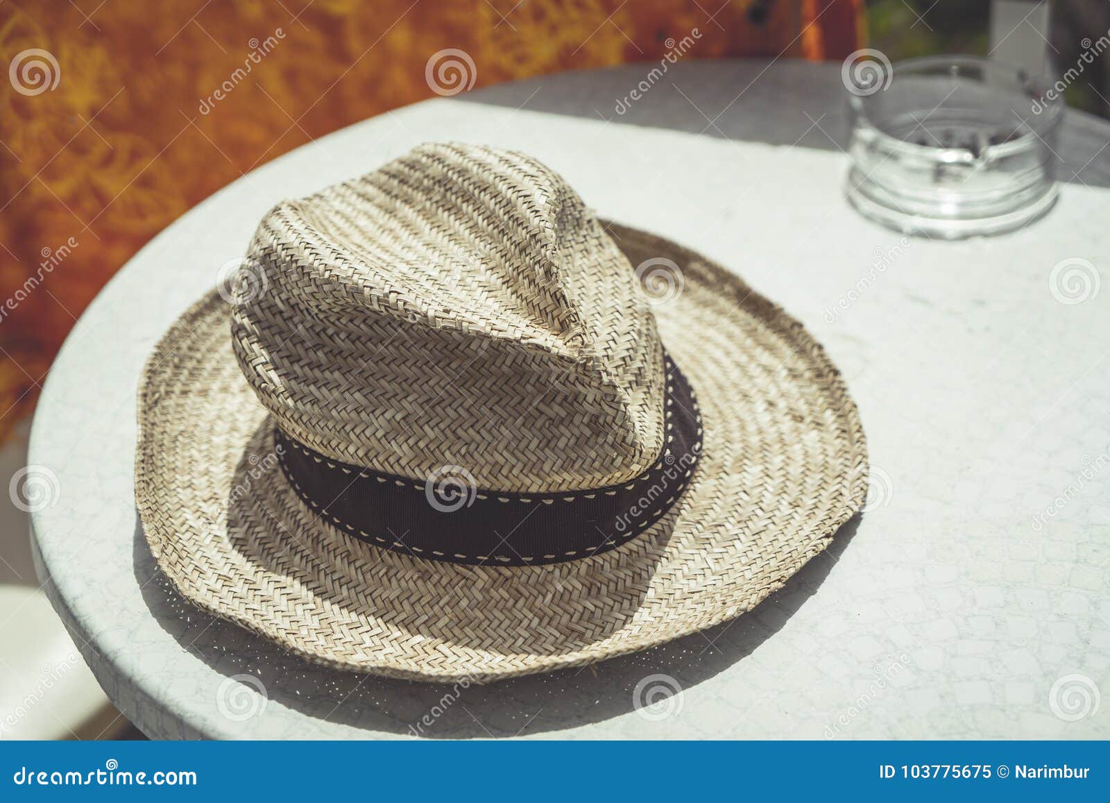 Old straw hat on a table stock image. Image of clothing - 103775675