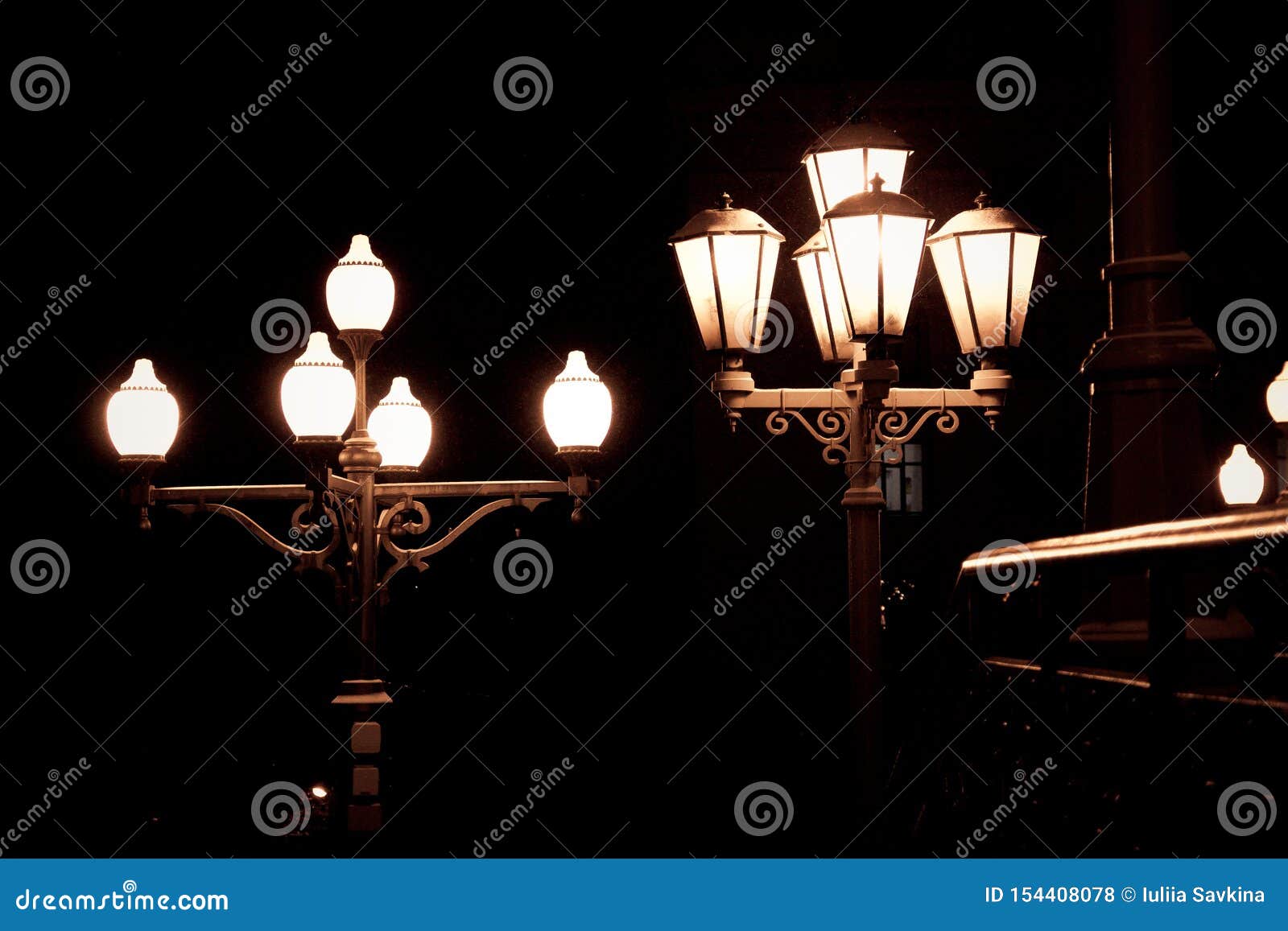 Old Street Electric Lights at Night on Black Background As Little