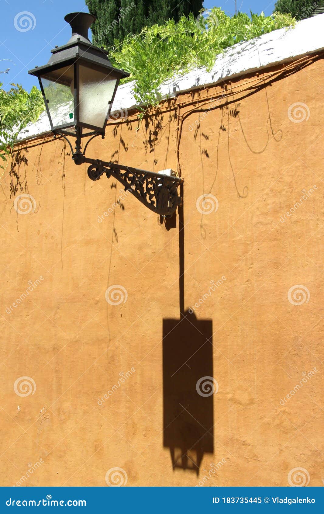 old street lamp on the wall in the center of seville