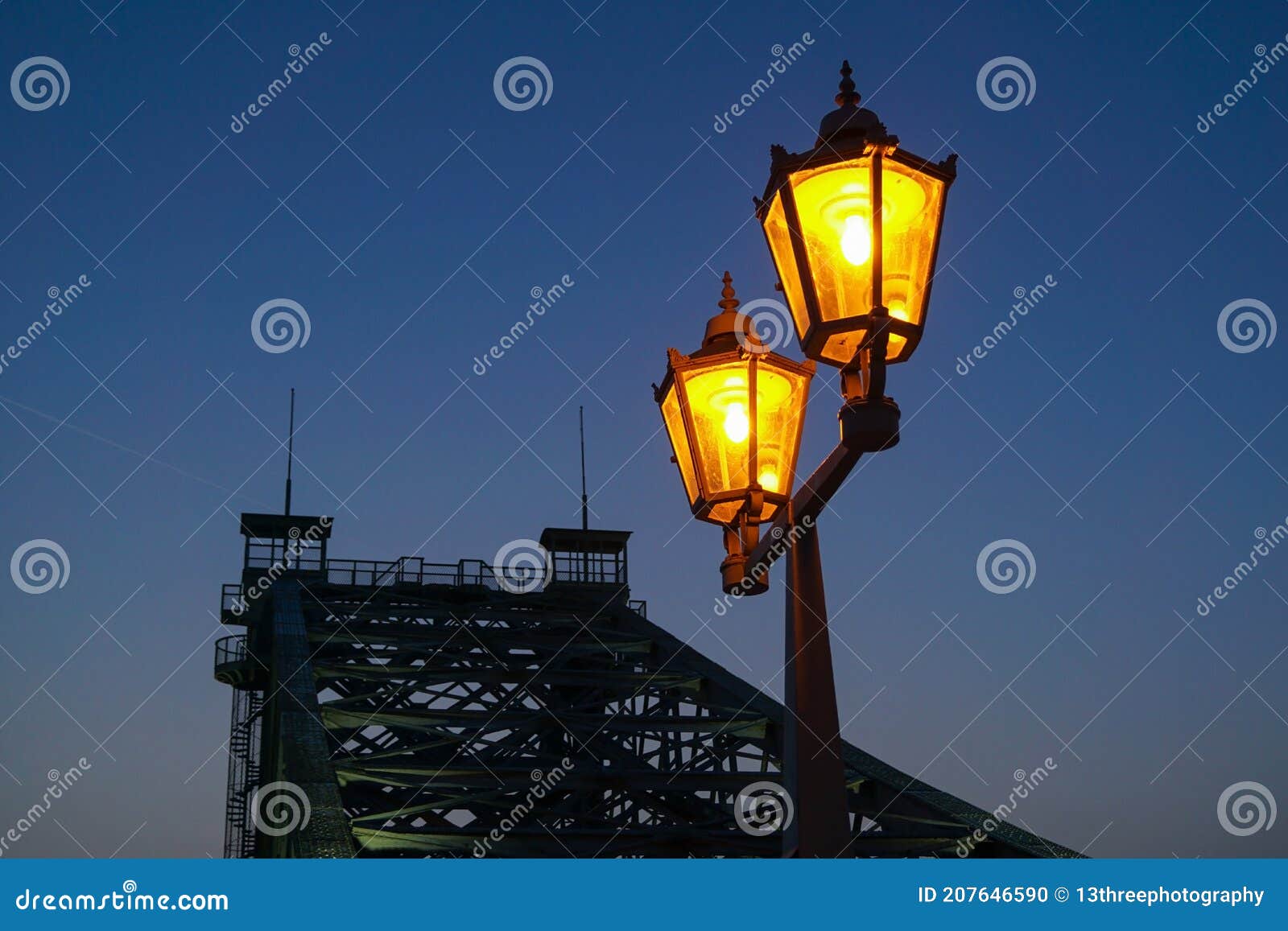 old street lantern in front of the loschwitzer bridge over the river elbe in dresden