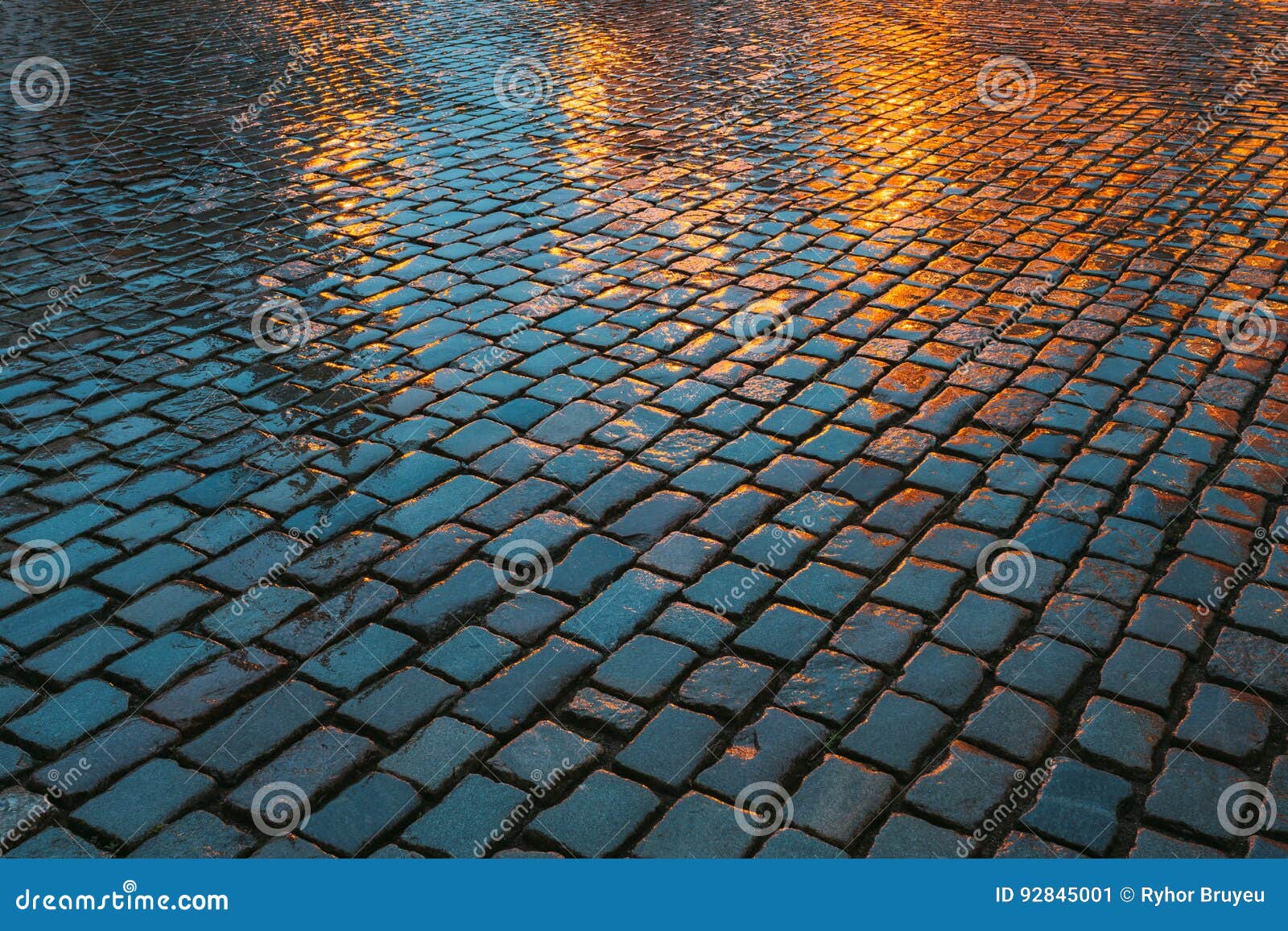 old streets cobblestone abstract background. wet stones in evening