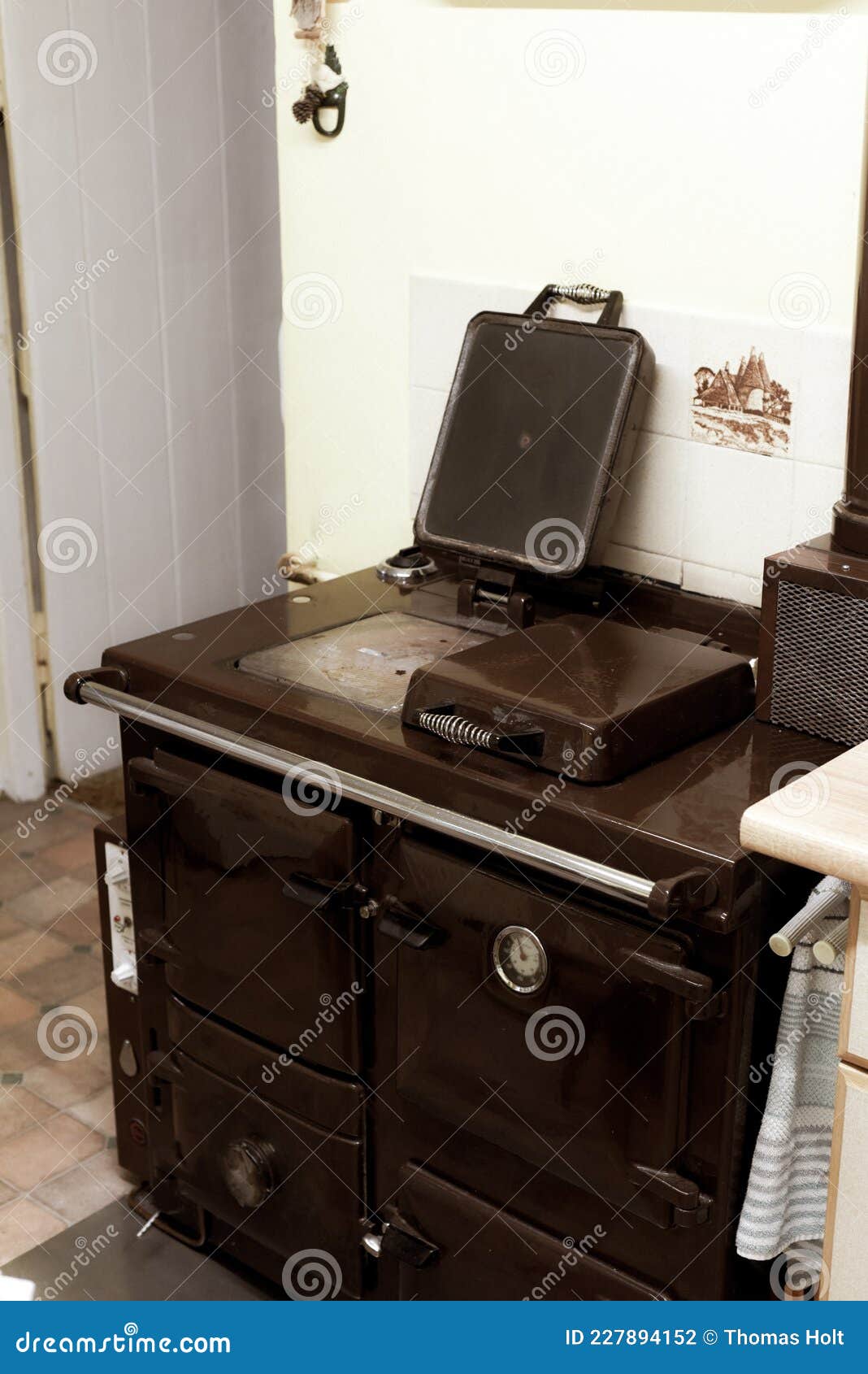 Old Style Oil Burning Stove in Retro Kitchen Interior Stock Photo