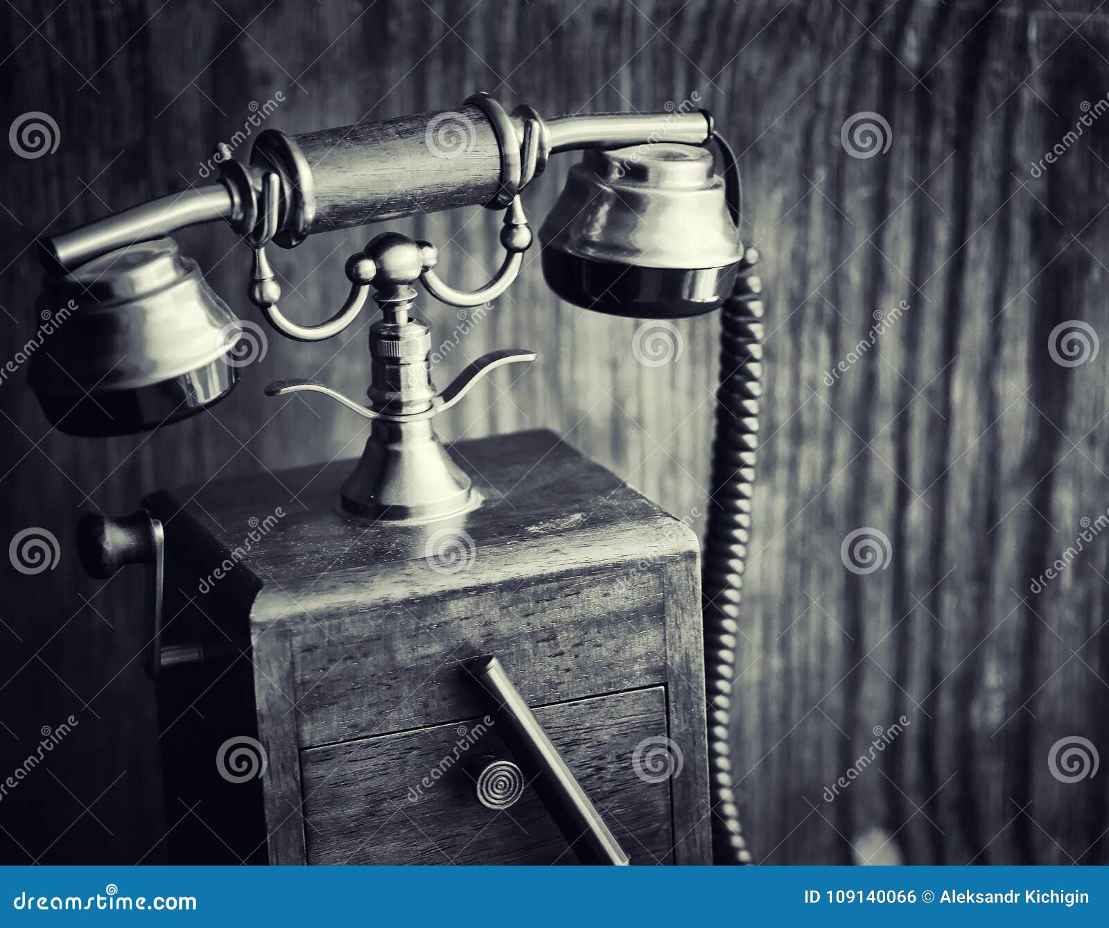 Old Telephone and Retro Book on the Desk. the Phone of the Past