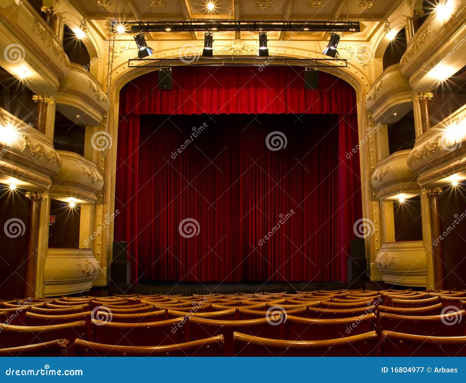 old theater stage and red curtain