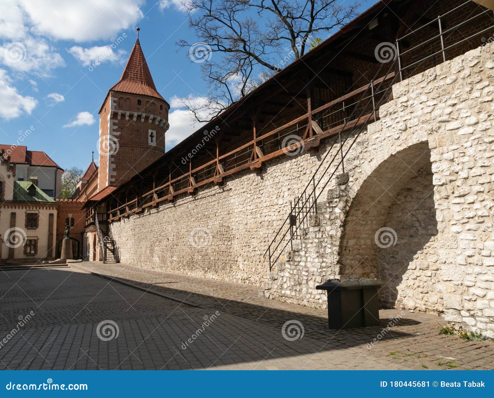 old town medieval walls and pijarska street. usually lively corner with outdoor art market, now empty due to coronavirus pandemi