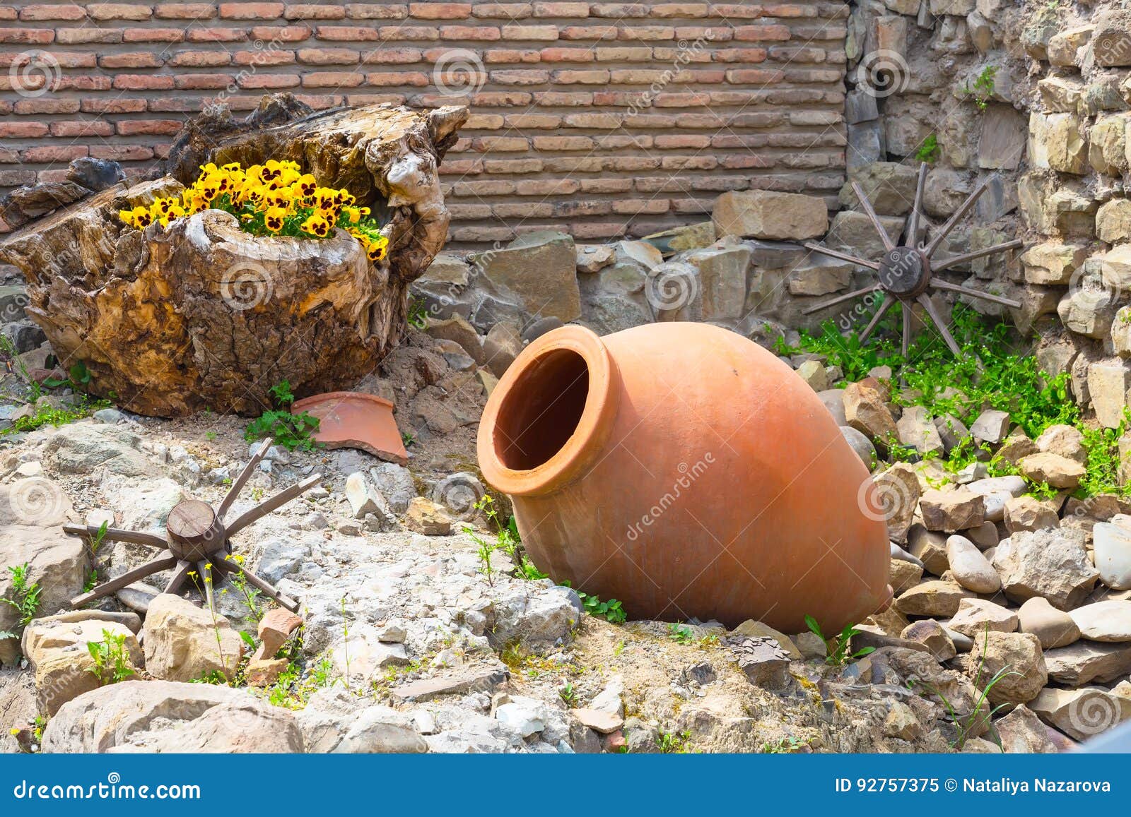 old traditional georgian wine region  background with wheel and qvevri jug