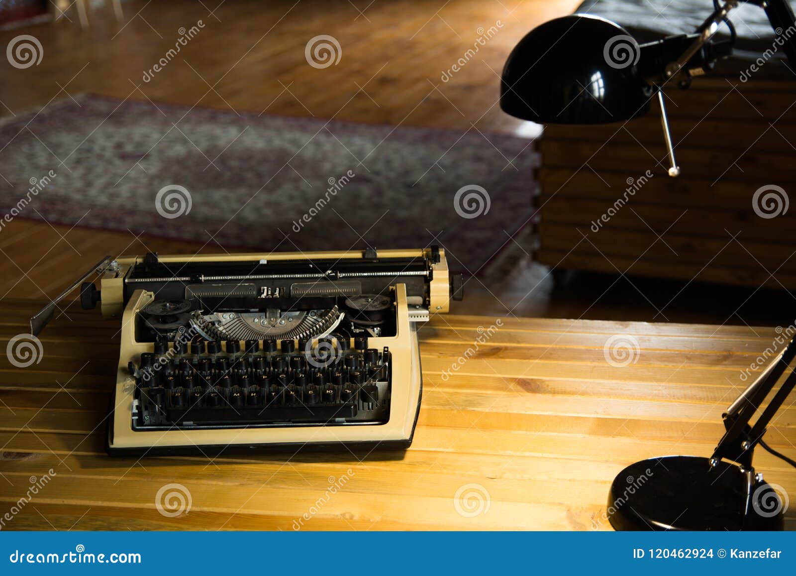 An Old Typewriter and a Lamp on a Wooden Lacquered Table and a Room
