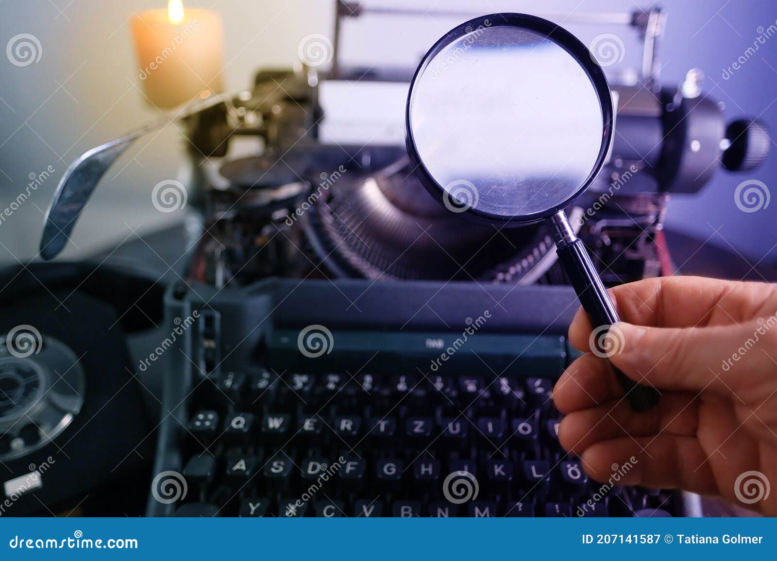 old typewriter on table, words true story are printed on paper in large size, retro style, magnifying glass, concept of writer,