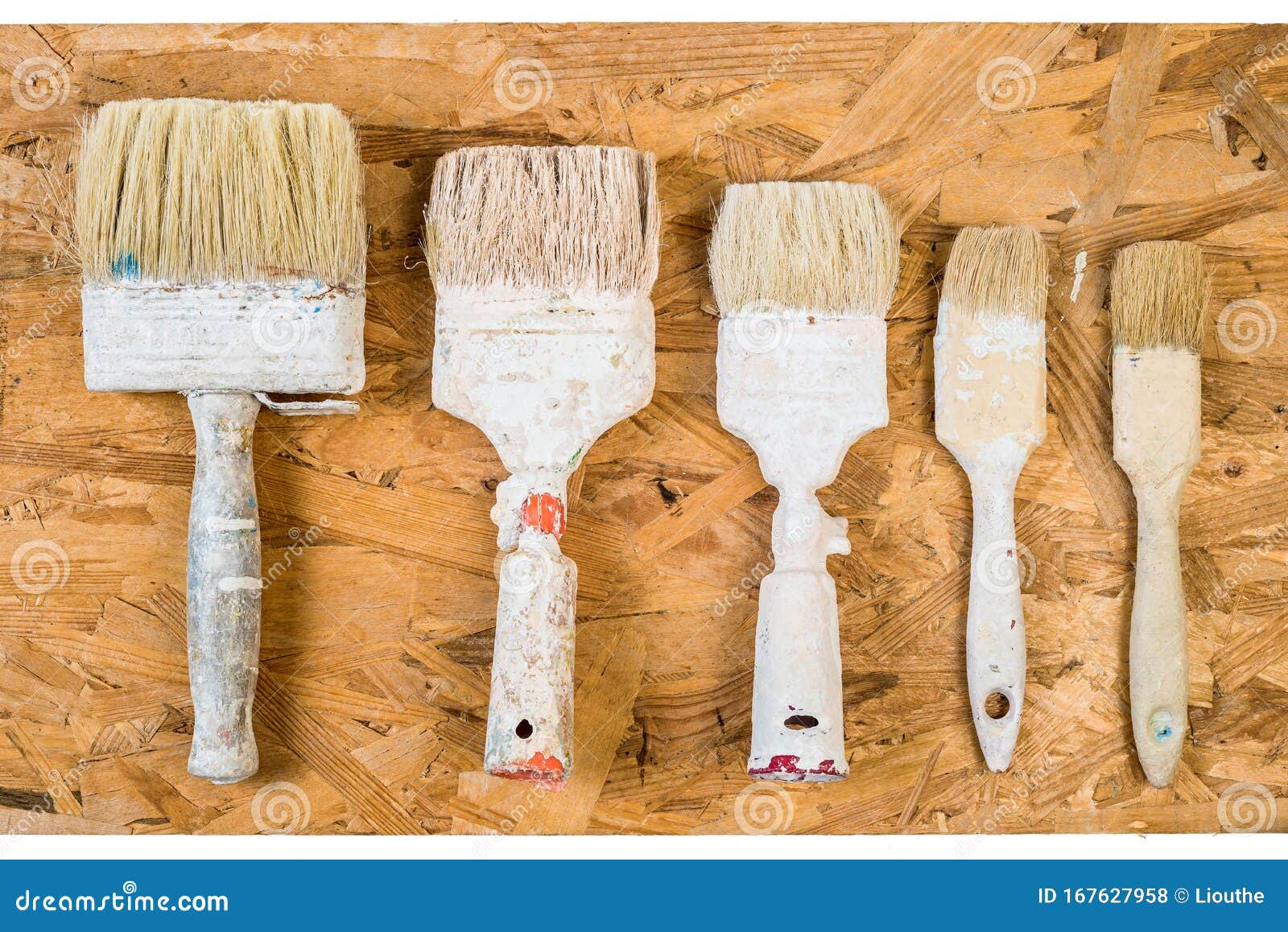 old used brushes on osb surface